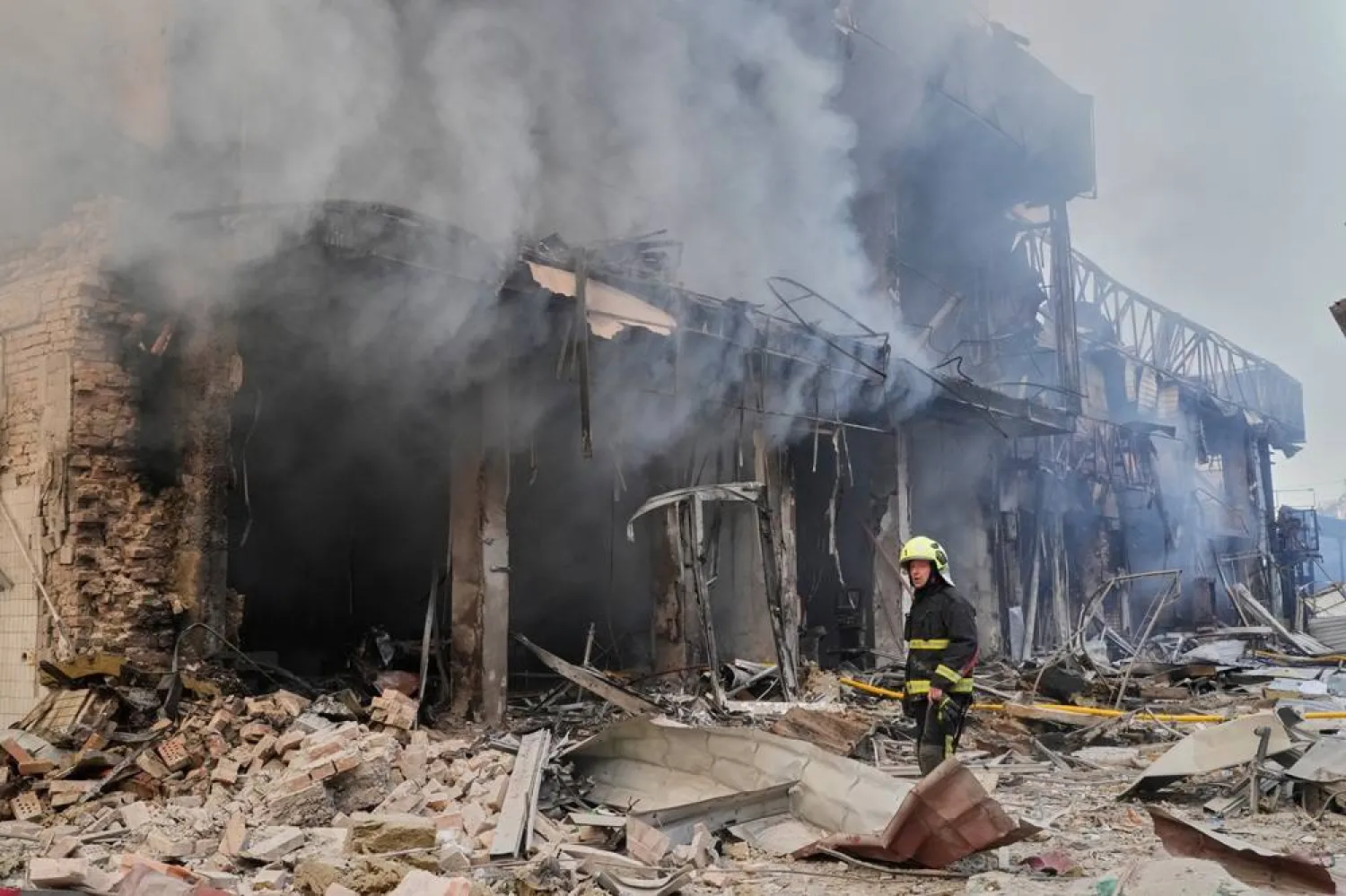 A firefighter tries to extinguish a blaze at a commercial building hit by a Russian attack in Kyiv, Ukraine, Sunday, May 24, 2026. (AP)