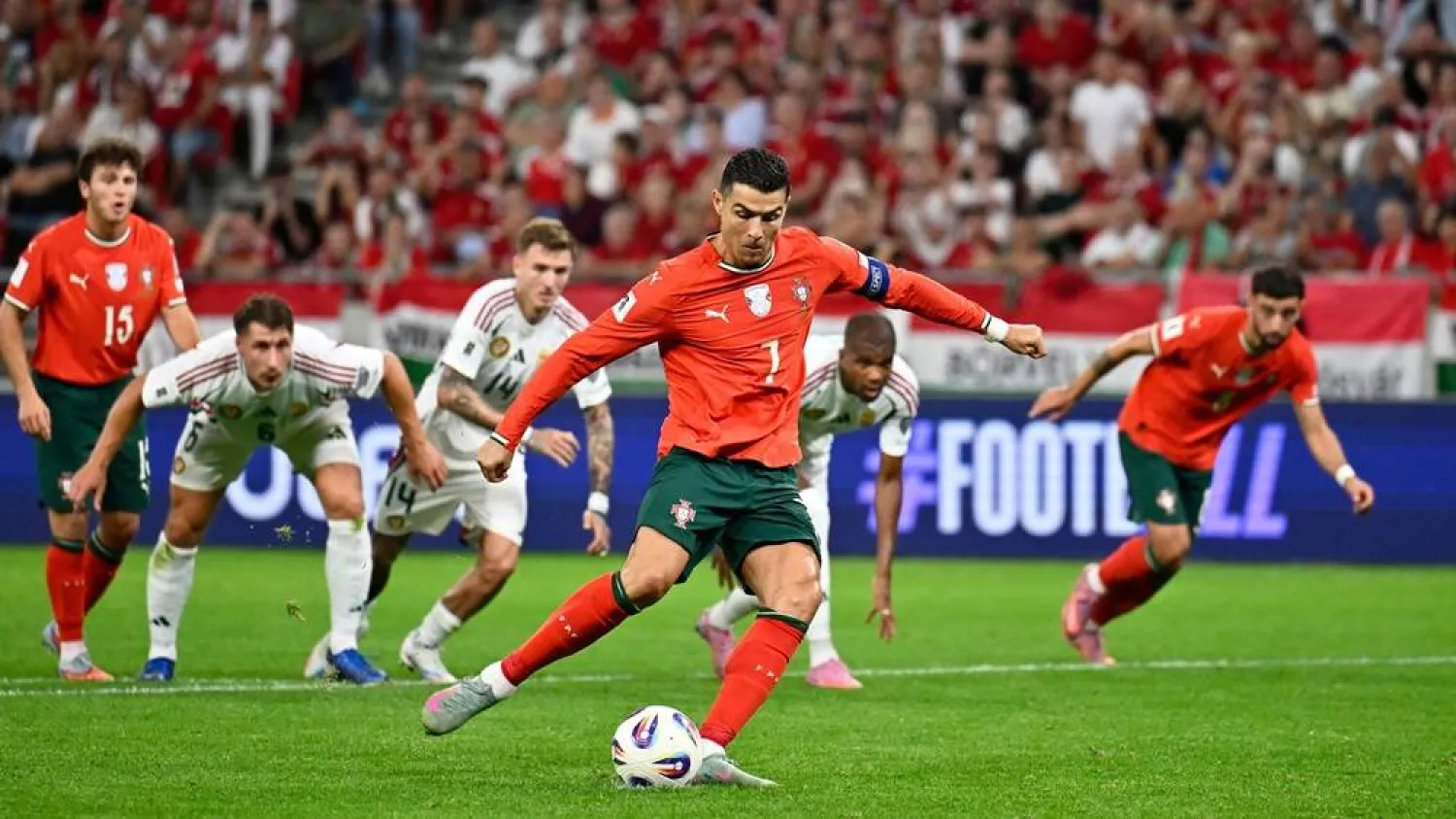 Portugal's Cristiano Ronaldo scores his side's second goal from the penalty spot during a World Cup 2026 group F qualifying match between Hungary and Portugal at the Puskas Arena in Budapest, Tuesday, Sept. 9, 2025. (AP) 