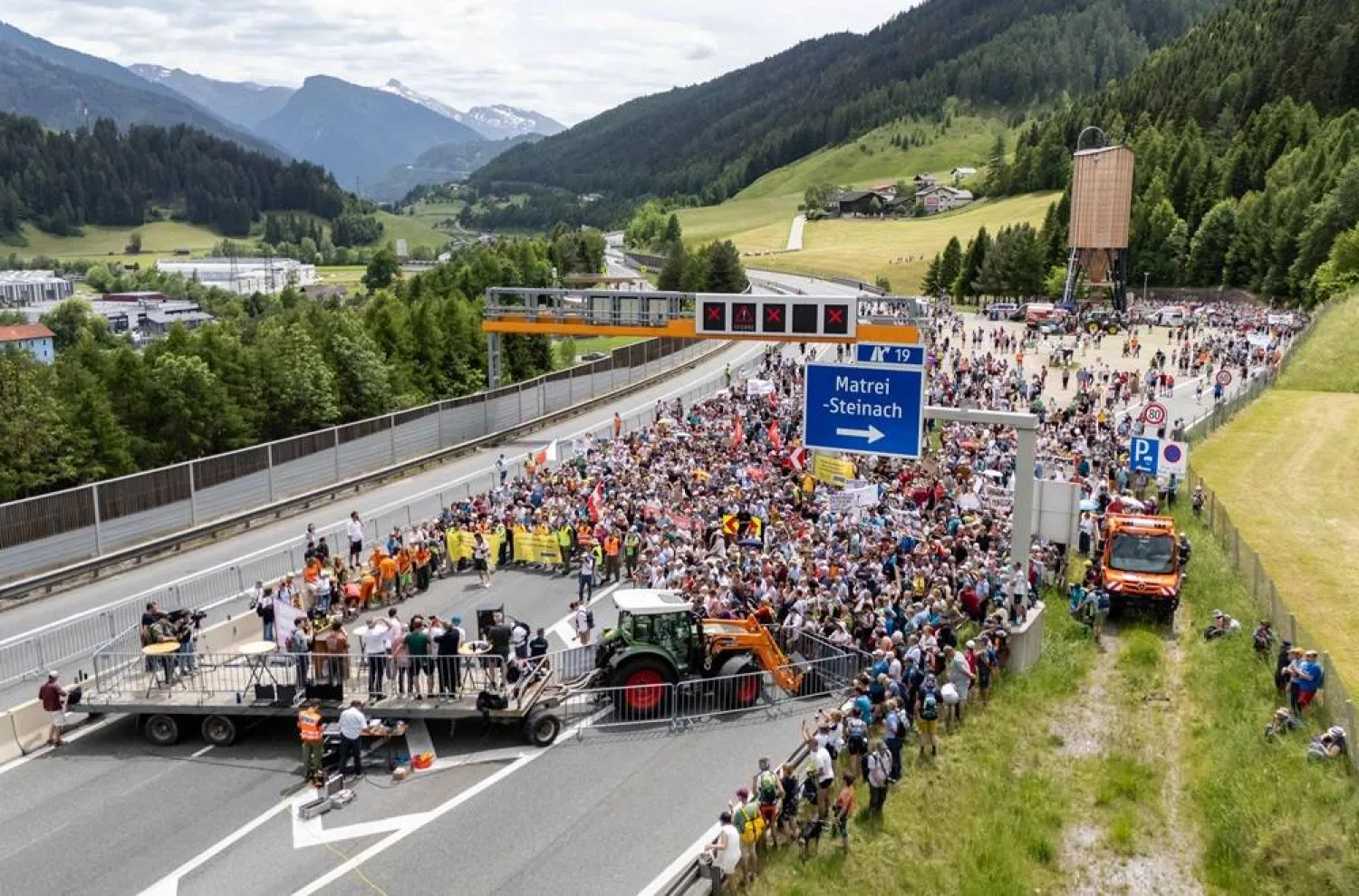 People demonstrate against transit traffic near the A13 Brenner Highway in the direction of Italy during the blockade of the Brenner Base Tunnel on May 30, 2026, on the Tyrolean Brenner Highway. (AFP)