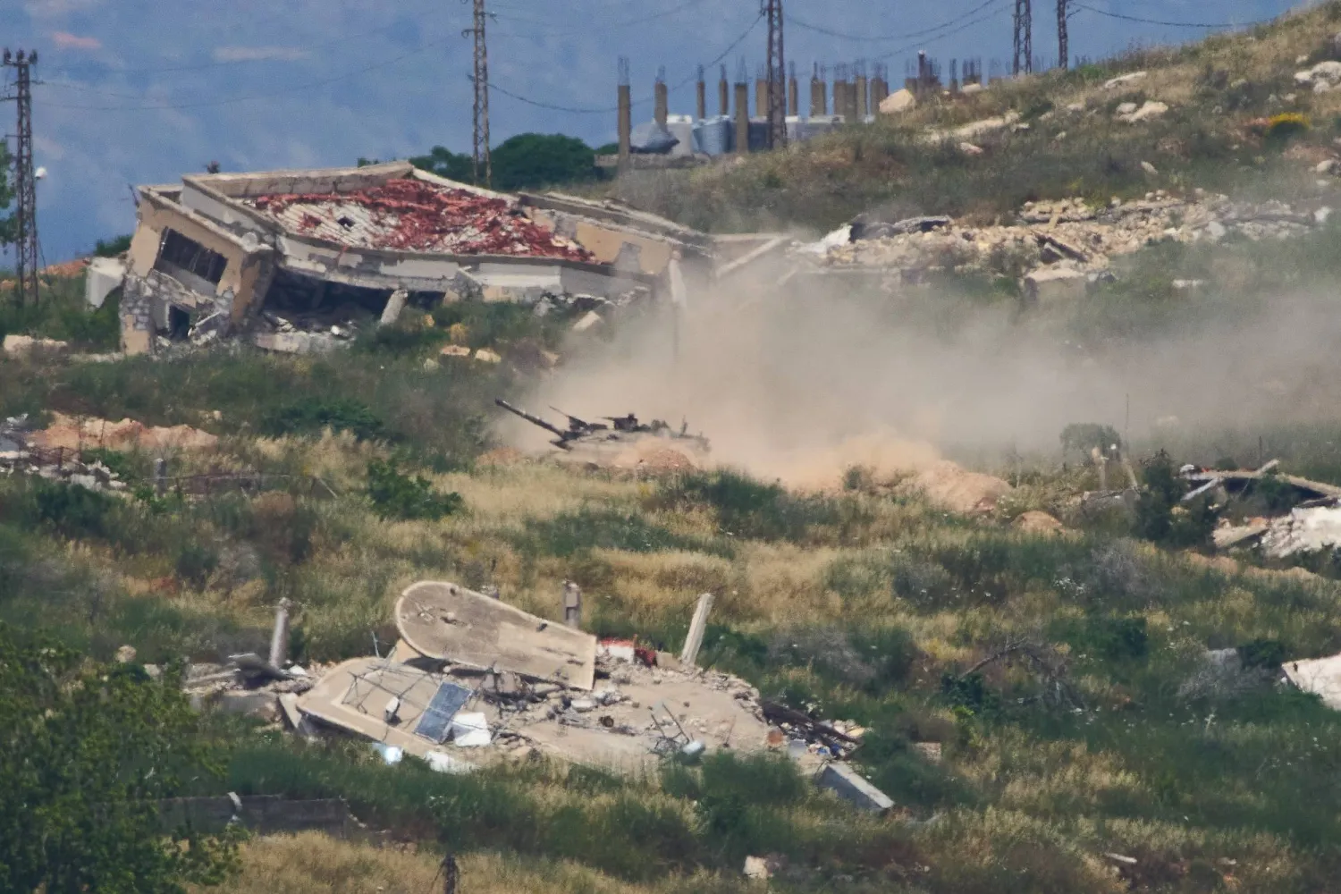 Israeli soldiers drive a tank in southern Lebanon as seen from northern Israel, Sunday, May 31, 2026. (AP Photo/Ariel Schalit)
