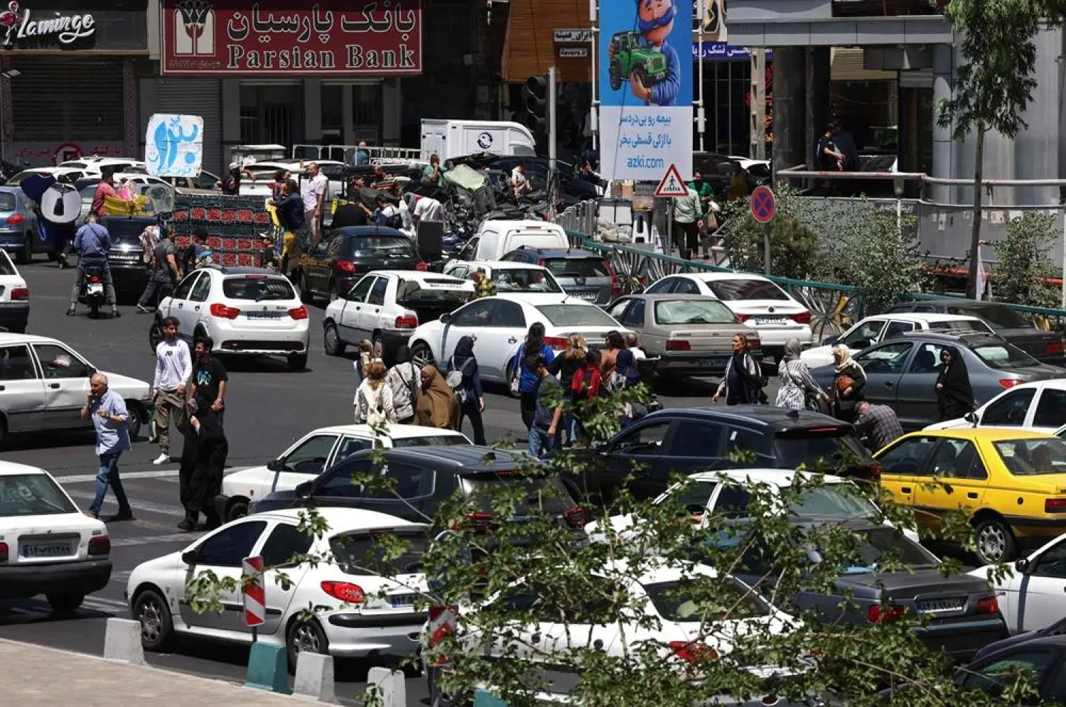 Commuters make their way along the busy Sadeghiyeh Square in Tehran on May 31, 2026. (AFP)