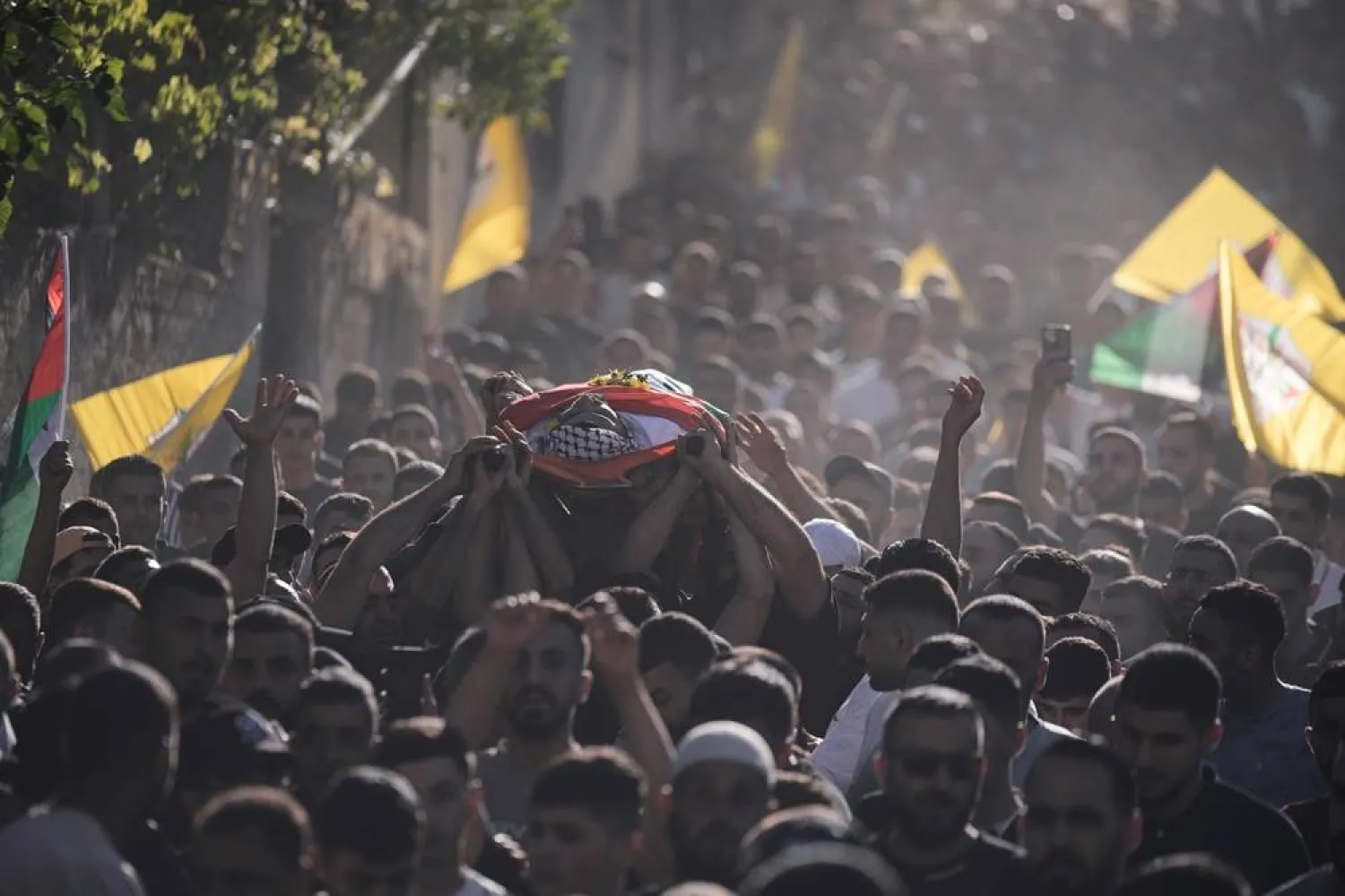 Mourners carry the body of Palestinian Imad Haroun Ishtayeh, 26, who was shot and killed by Israeli forces on Sunday at a concrete barrier separating the occupied West Bank from Jerusalem, during his funeral in the village of Salem, east of Nablus, Sunday, May 31, 2026. (AP) 