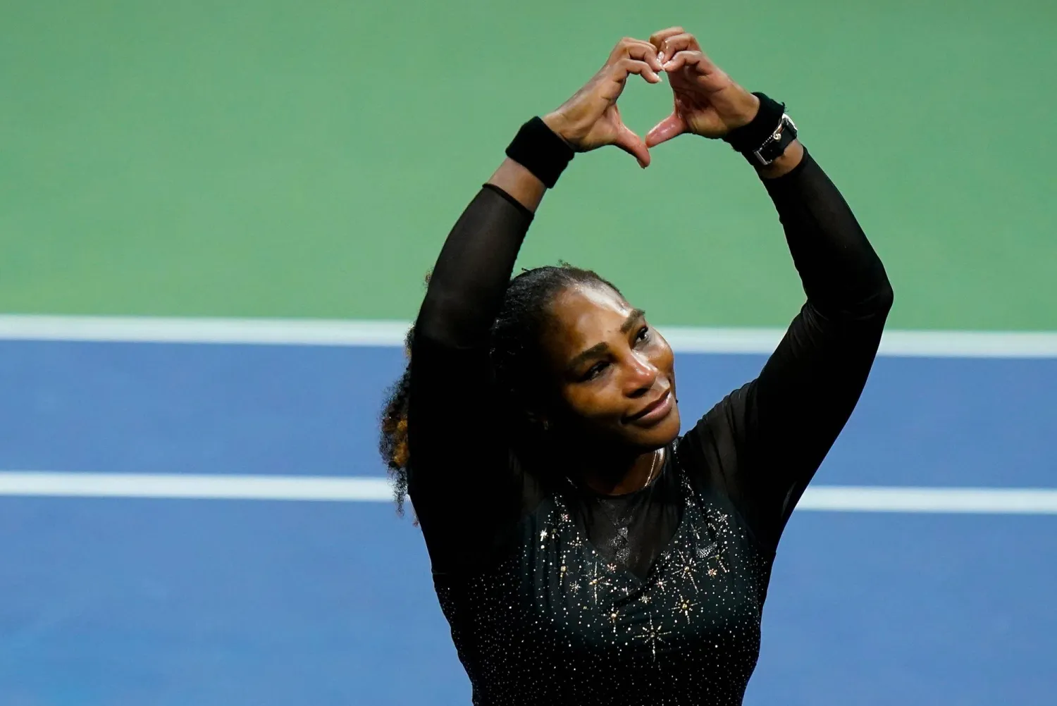 Serena Williams motions a heart to fans during the third round of the US Open tennis championships, Sept. 2, 2022, in New York. (AP)