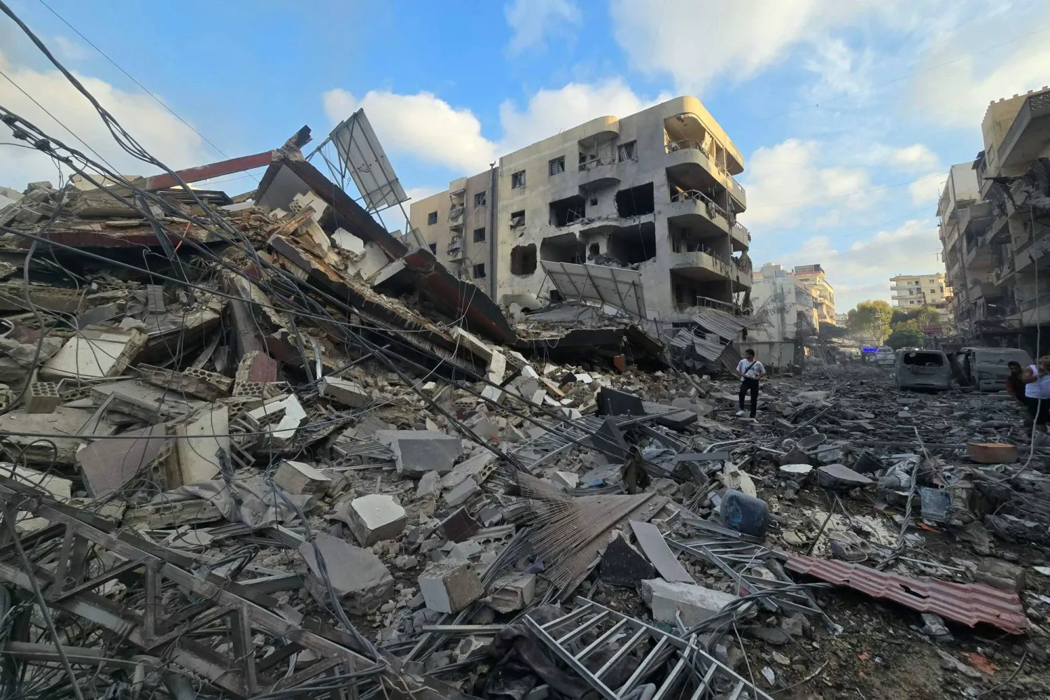 People gather at the site of an Israeli strike that hit near a hospital in the southern Lebanese city of Tyre on June 1, 2026. (AFP)