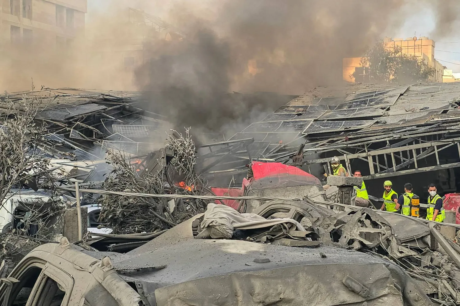 First responders gather at the site of an Israeli strike that hit near a hospital in the southern Lebanese city of Tyre on June 1, 2026. (Photo by KAWNAT HAJU / AFP)
