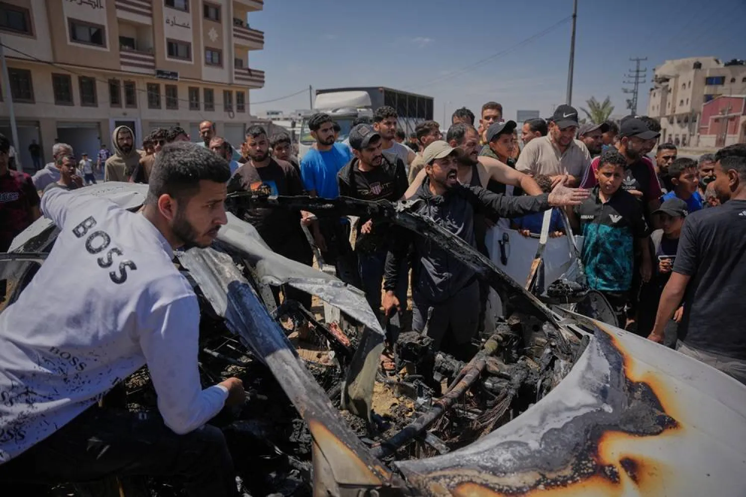 Palestinians inspect a vehicle hit by an Israeli airstrike in Deir al-Balah, in the central Gaza Strip, Tuesday, June 2, 2026. (AP) 