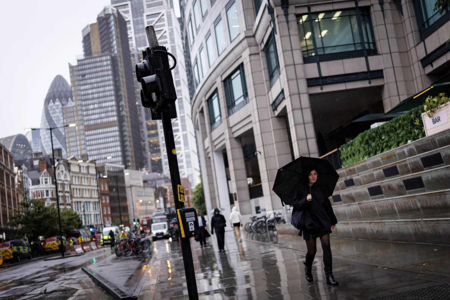 A person walks with an umbrella during the rain in the City of London financial district in London, Britain, 02 June 2026. EPA/TOLGA AKMEN