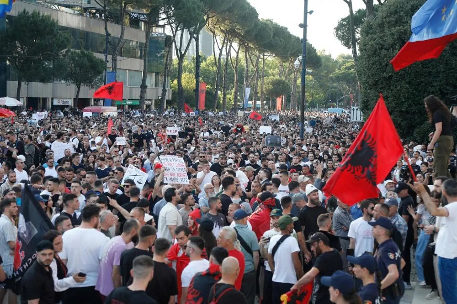 Protestors take part in a demonstration in front of the prime minister's office, against the construction of a luxury resort near a protected natural area, in Tirana on June 2, 2026. (AFP)