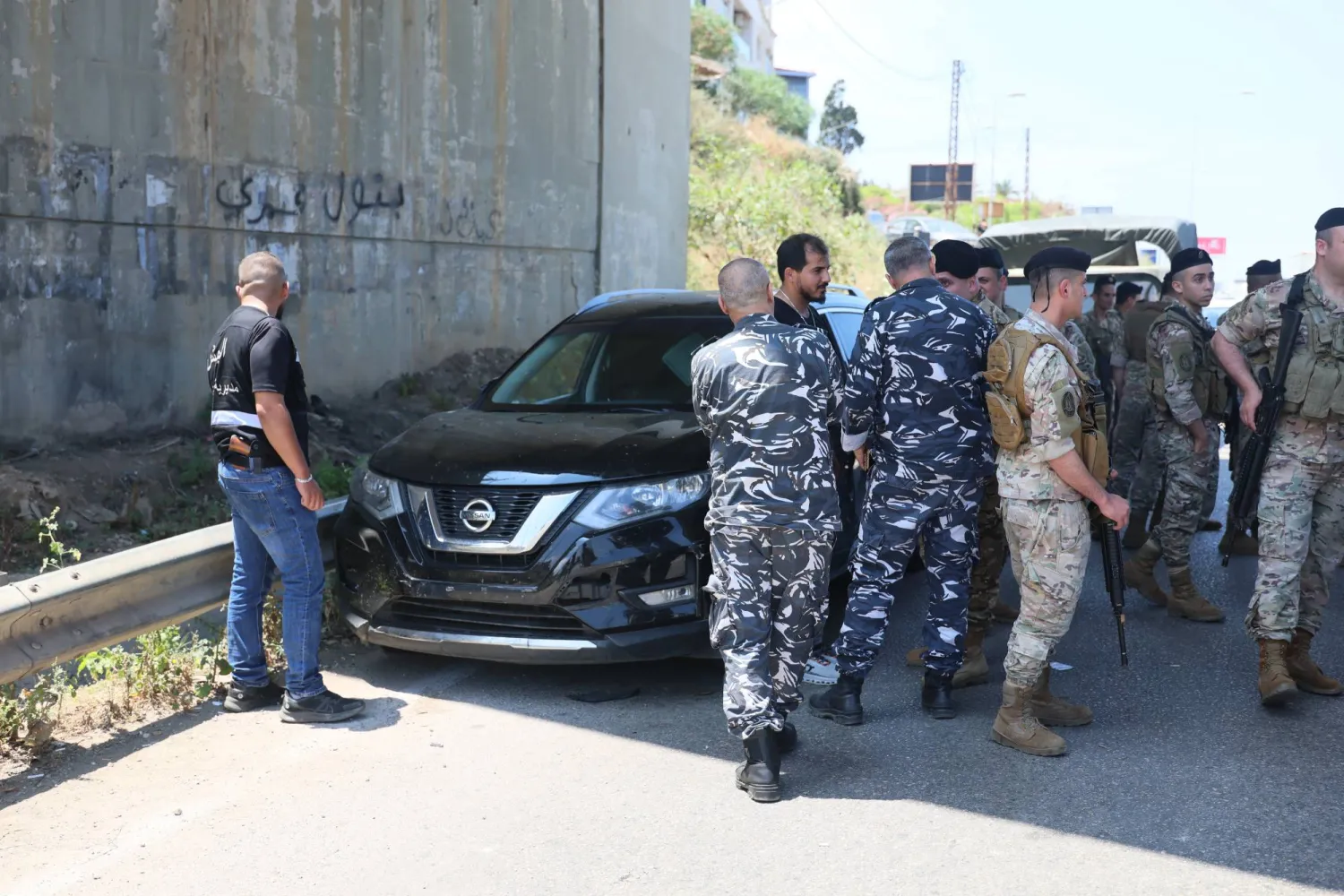 Lebanese soldiers gather near a car hit by an Israeli drone in the Khaldeh area at the southern entrance to Beirut, Lebanon, 03 June 2026. EPA/WAEL HAMZEH