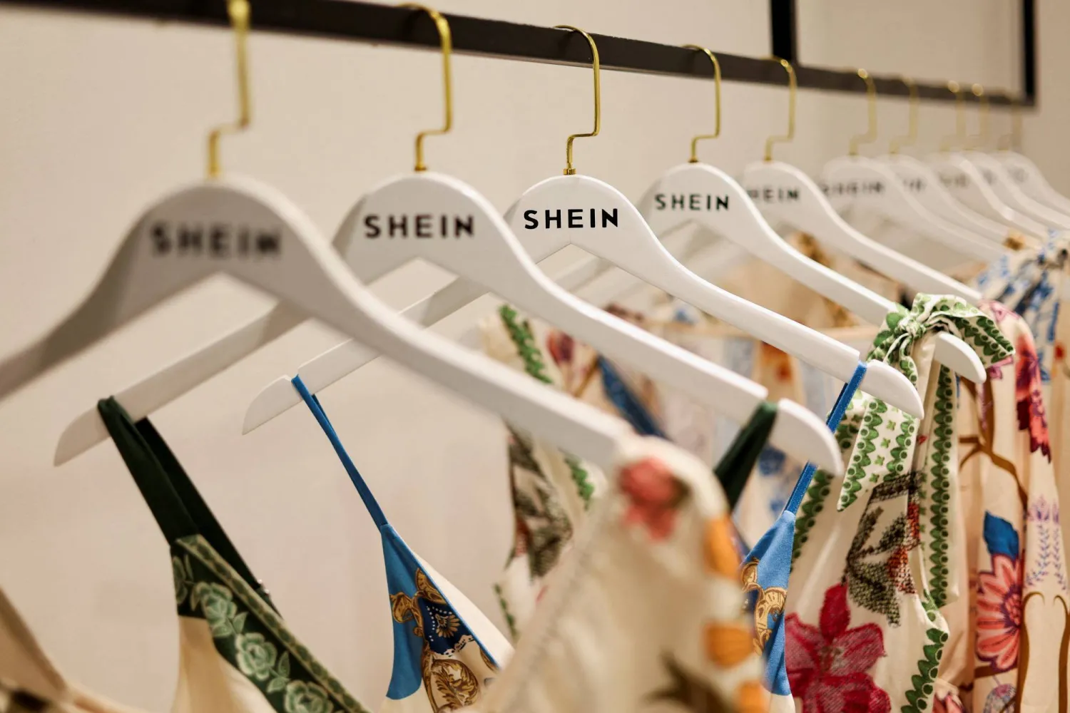 FILE PHOTO: Clothes from fast-fashion brand Shein hang at their office in Sao Paulo, Brazil, December 15, 2025. REUTERS/Jorge Silva/File Photo