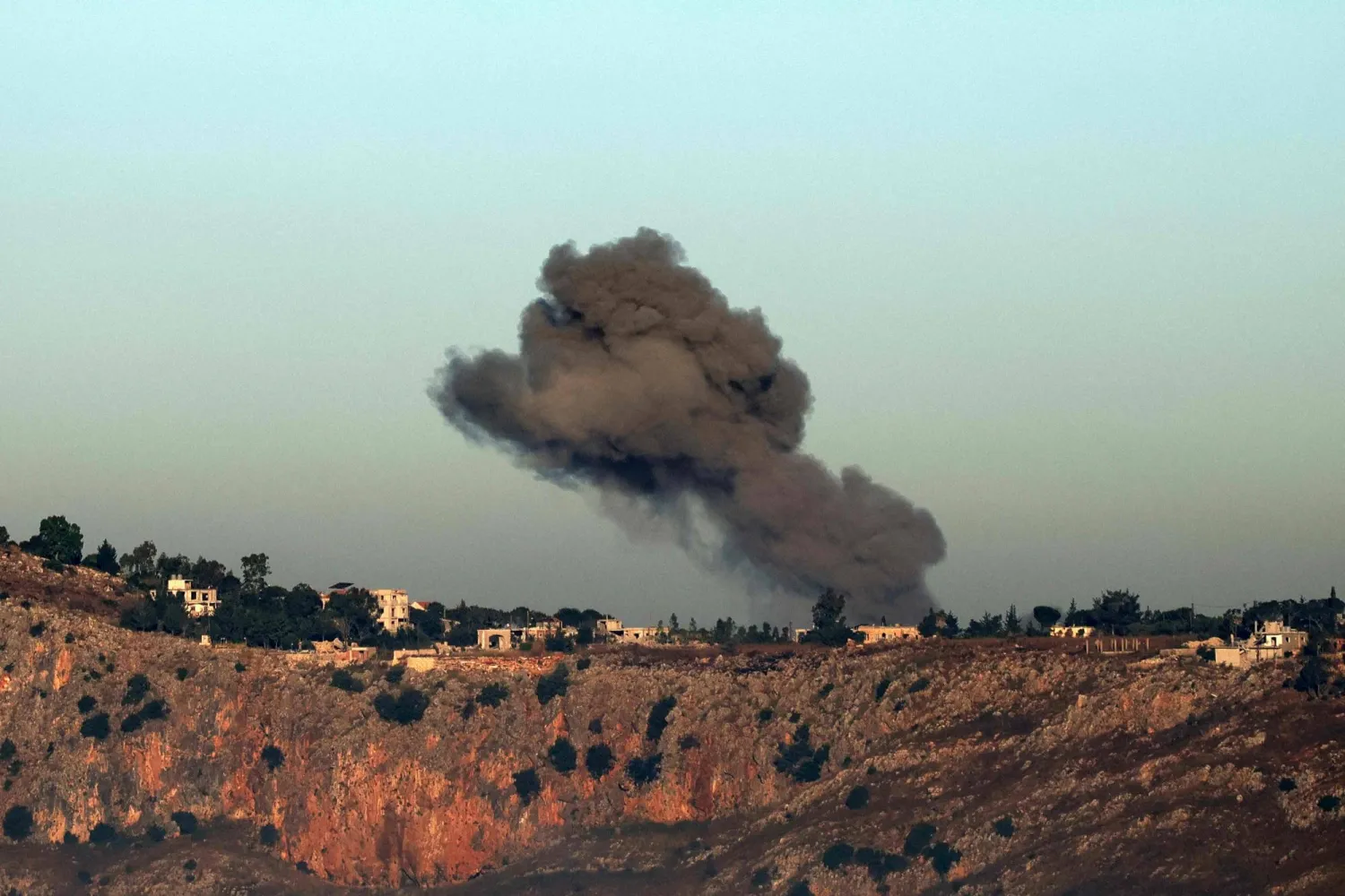 This photograph taken from the southern Lebanese area of Marjeyoun shows smoke rising from the site of an Israeli strike that targeted the village of Arnoun on June 3, 2026. (AFP)