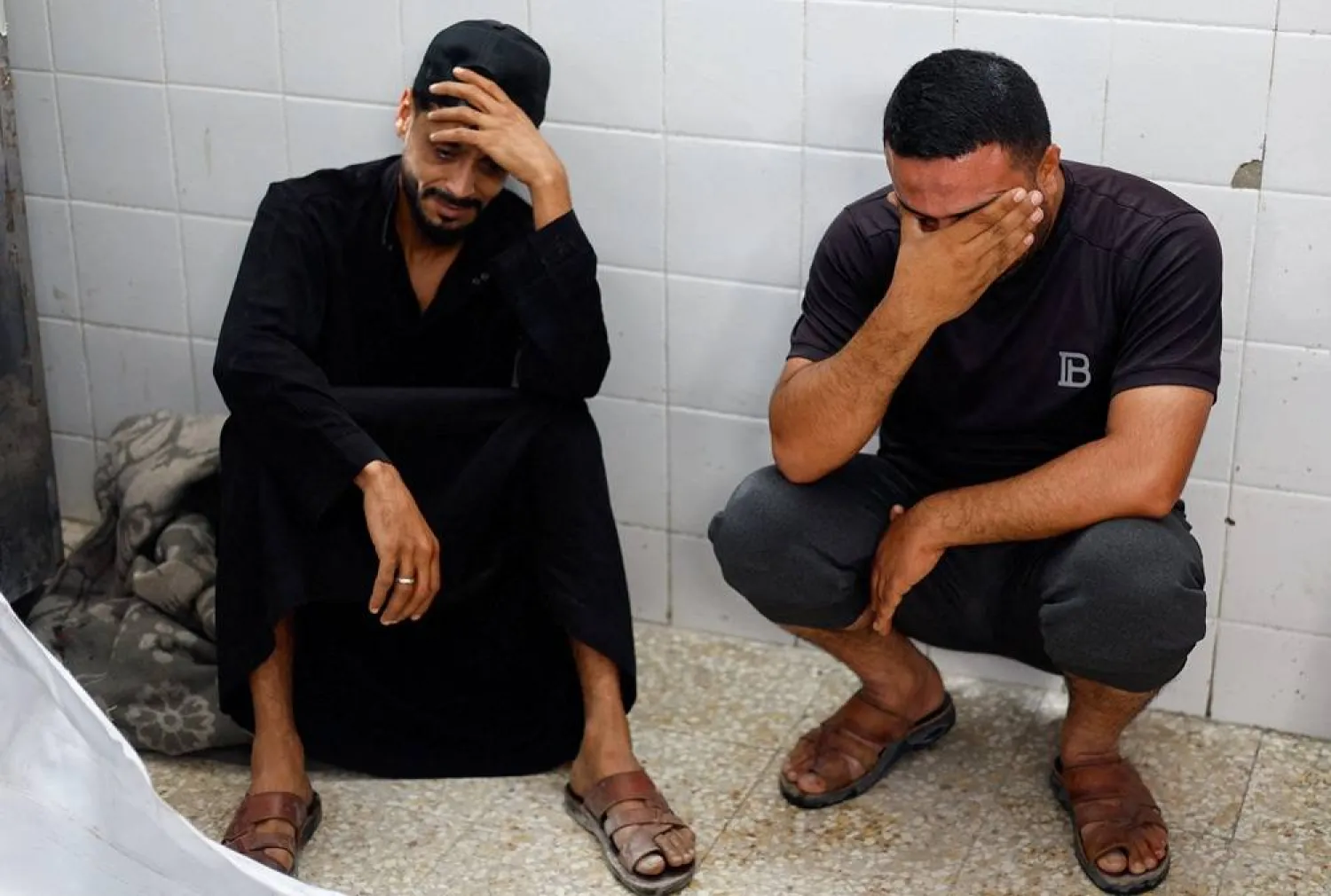 Mourners react during the funeral of brothers Saqer and Moamen ‌Khalil Abu Karim, who were killed in an Israeli strike, according to medics, at Al-Aqsa Martyrs Hospital in Deir al-Balah, in the central Gaza Strip, June 3, 2026. (Reuters)