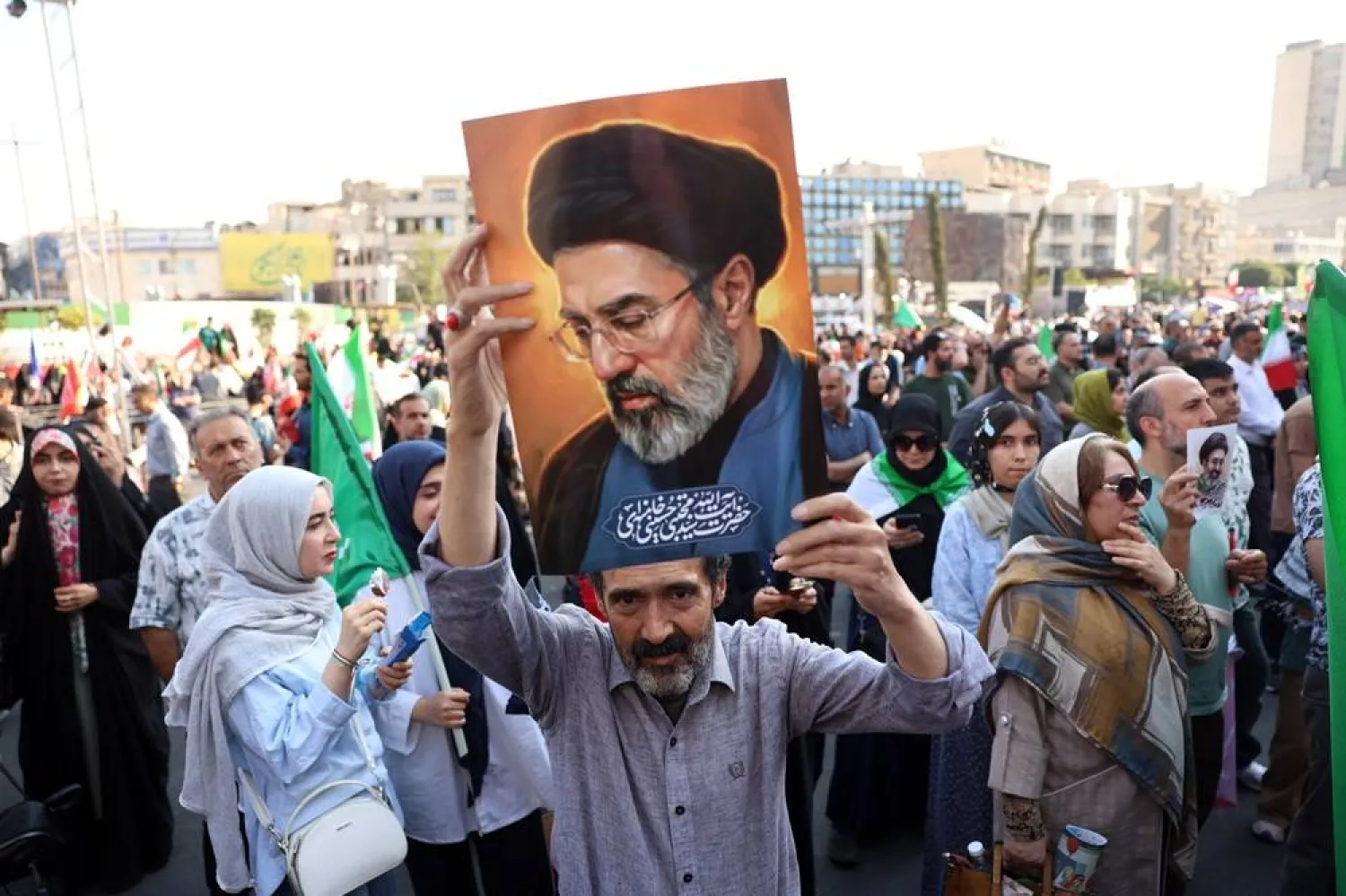 An Iranian man holds up a portrait of Supreme Leader Mojtaba Khamenei during a rally in Tehran, Iran, 4 June 2026, amid a temporary ceasefire between Iran and the United States. (EPA)