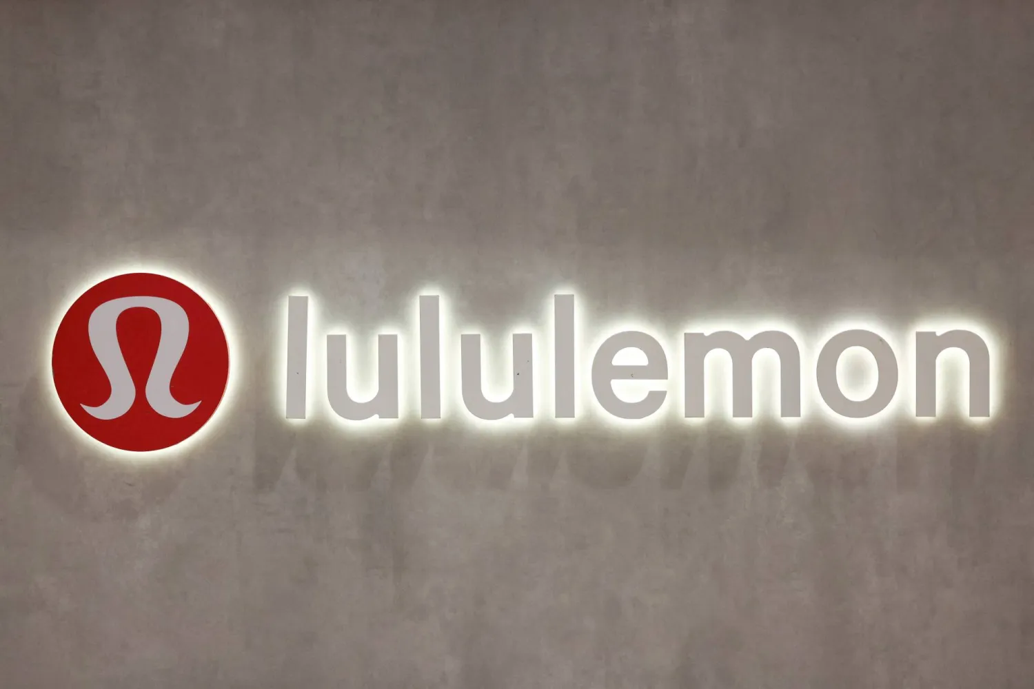 FILE PHOTO: A logo is displayed inside a Lululemon outlet retail store at Bicester Village in Oxfordshire, Britain, August 21, 2024. REUTERS/Hollie Adams/File Photo