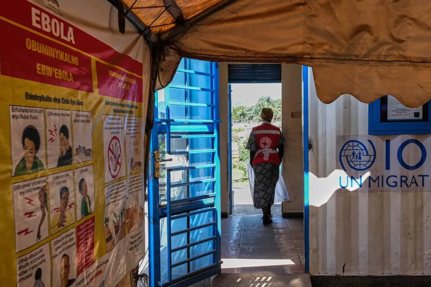  A health worker stands at a temporary health clinic at the Mpondwe border crossing linking Uganda and the Democratic Republic of the Congo, Thursday, June 4, 2026. (AP) 