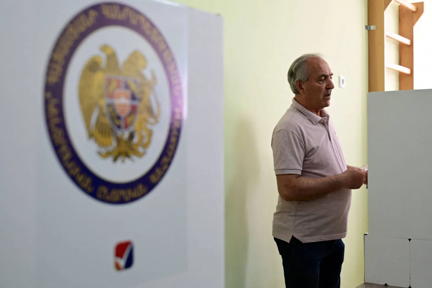  A man votes in Armenia's parliamentary election at a polling station in Yerevan on June 7, 2026. (AFP) 