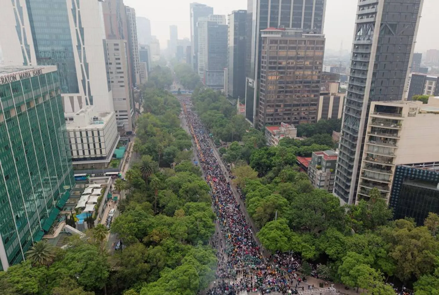 A drone view of people participating in an attempt to break the Guinness World Record for the world’s largest “Mexican wave” along Reforma Avenue as part of activities ahead of the FIFA World Cup 2026, in Mexico City, Mexico, June 6, 2026. (Reuters) 