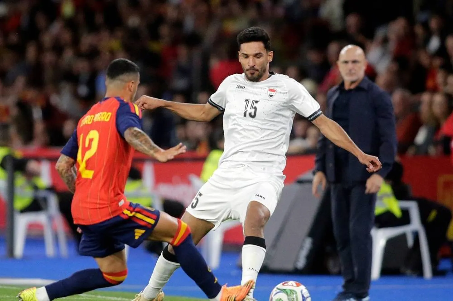 Football - International Friendly - Spain v Iraq - Riazor stadium, A Coruna, Spain - June 4, 2026 Iraq's Ahmed Yahya Mhmood Al Hajjaj in action with Spain's Pedro Porro. (Reuters)