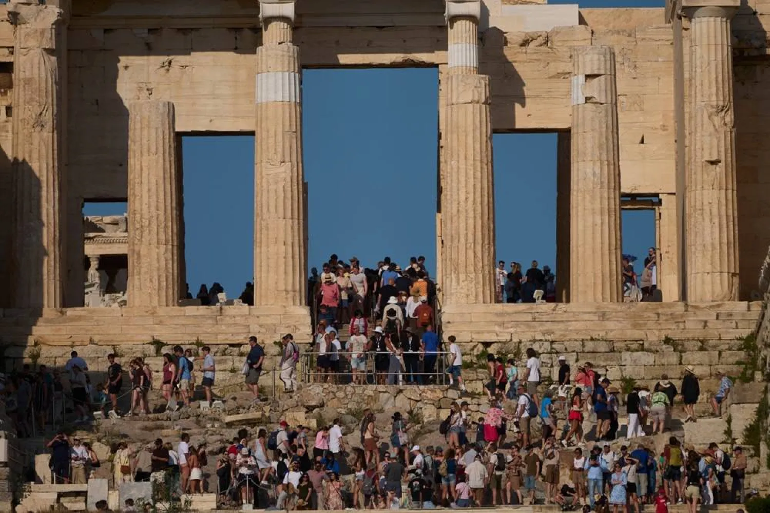  Tourists visit the 5th century BC Propylaea on the Acropolis Hill during a hot day, in Athens, Greece, Thursday, May 28, 2026. (AP)