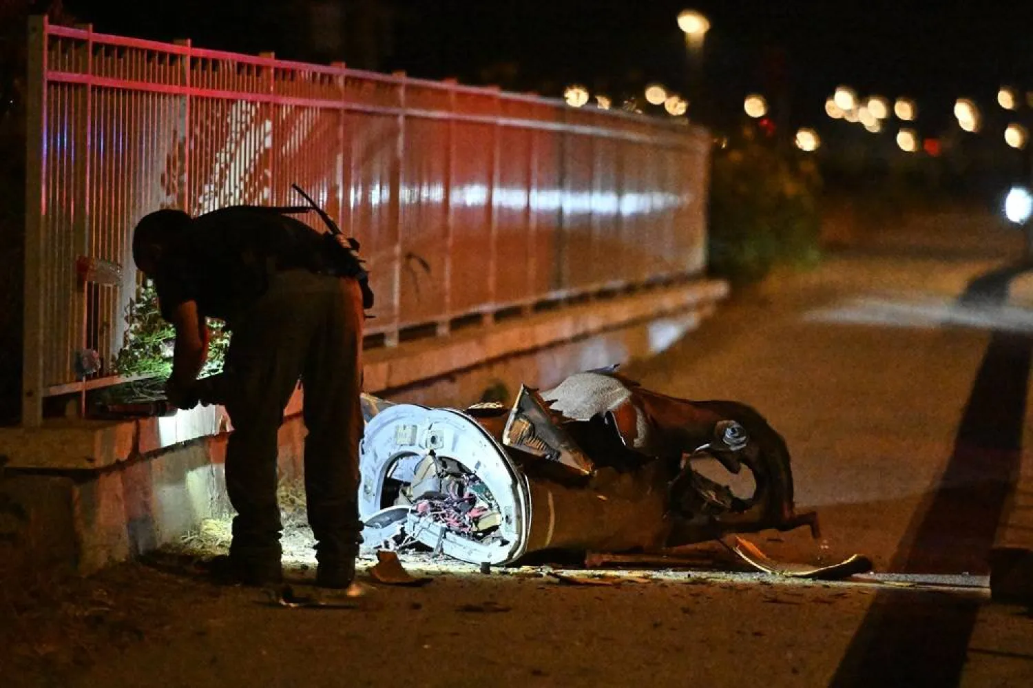  Israeli security forces examine a fragment of an intercepted Iranian missile in northern Israel, early Monday, June 8, 2026. (AP) 