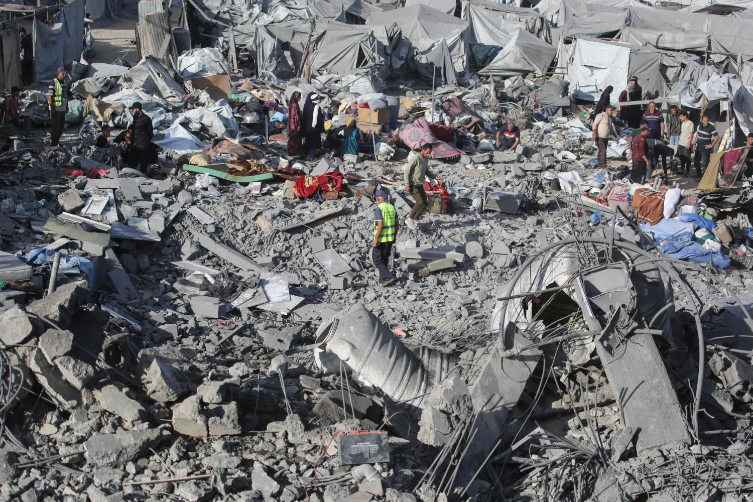 Palestinians assess damage at the site of an Israeli airstrike in Khan Younis, southern Gaza Strip, on June 7, 2026. (AFP)