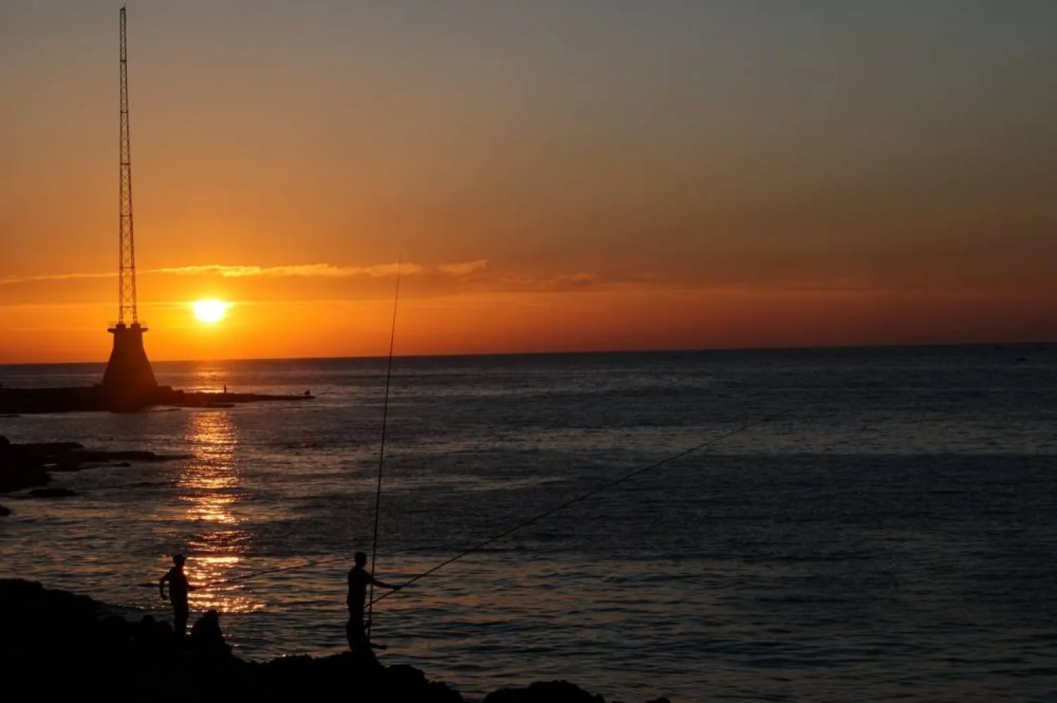 People fish at sunset near the Corniche Al-Manara seafront promenade on the Mediterranean coast in Beirut, Lebanon, 05 June 2026. (EPA)