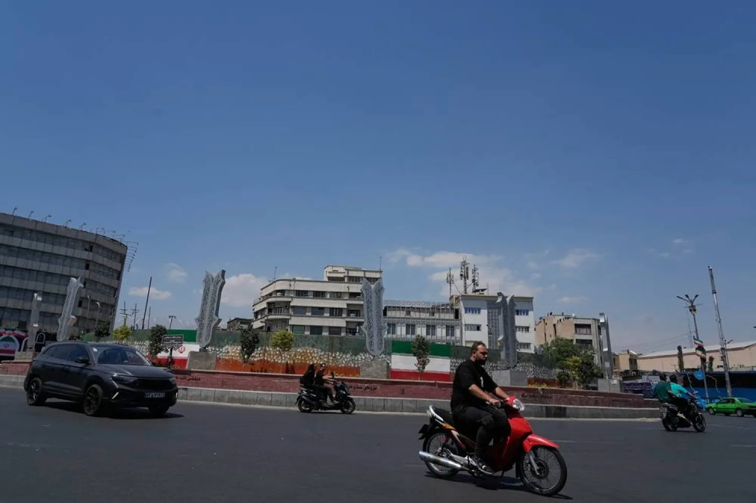  Vehicles drive at a square in Tehran, Iran, Monday, June 8, 2026. (AP) 