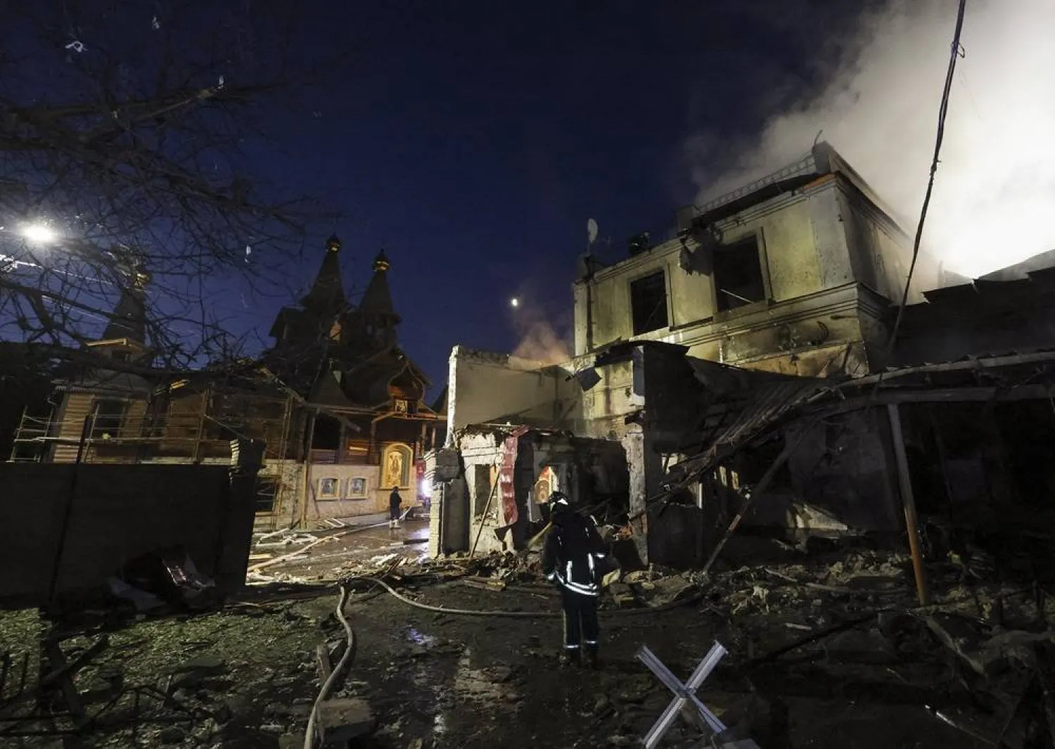 Ukrainian rescuers work at the site of a Russian strike on a residential area in Kharkiv, Ukraine, 09 June 2026, amid the ongoing Russian invasion. (EPA)