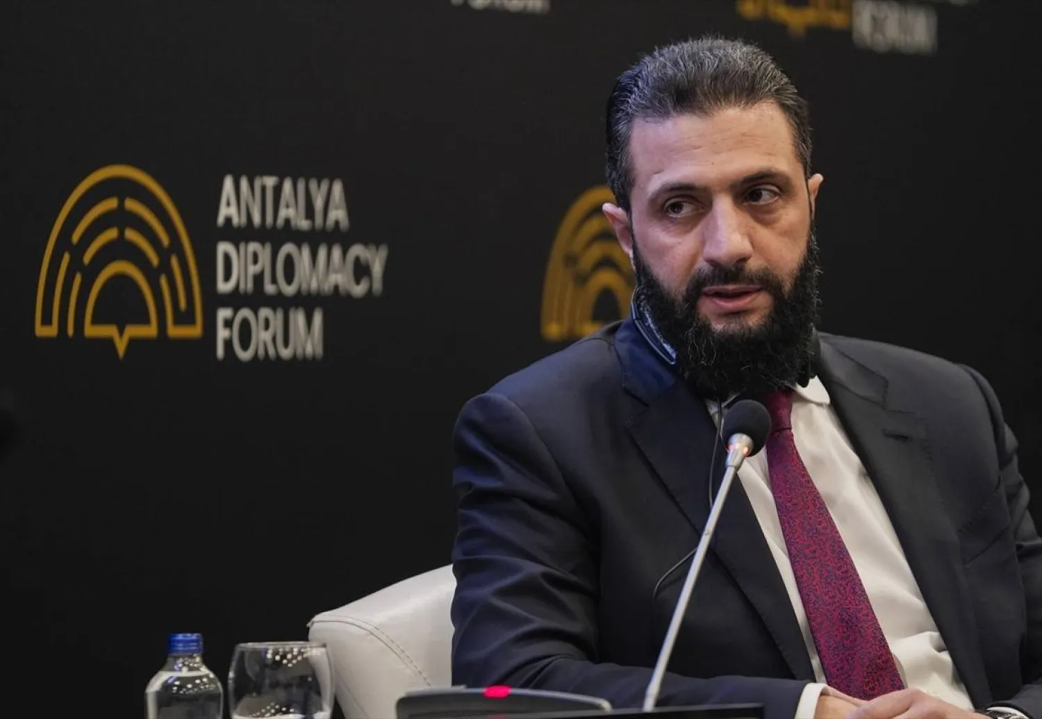 Al-Share speaking at the Antalya Diplomacy Forum (AP)