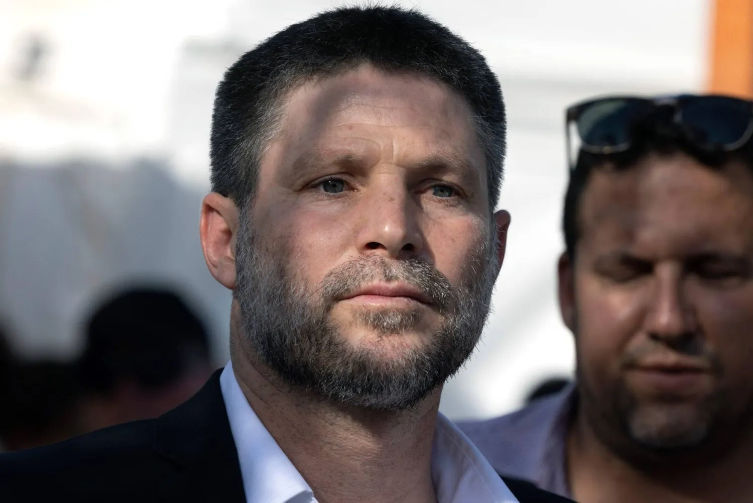 Israel's Finance Minister Bezalel Smotric looks on as he addresses the relatives of Israelis being held hostage by Palestinian group Hamas in the Gaza Strip, during a rally in the center of Jerusalem on June 3, 2024. (AFP)