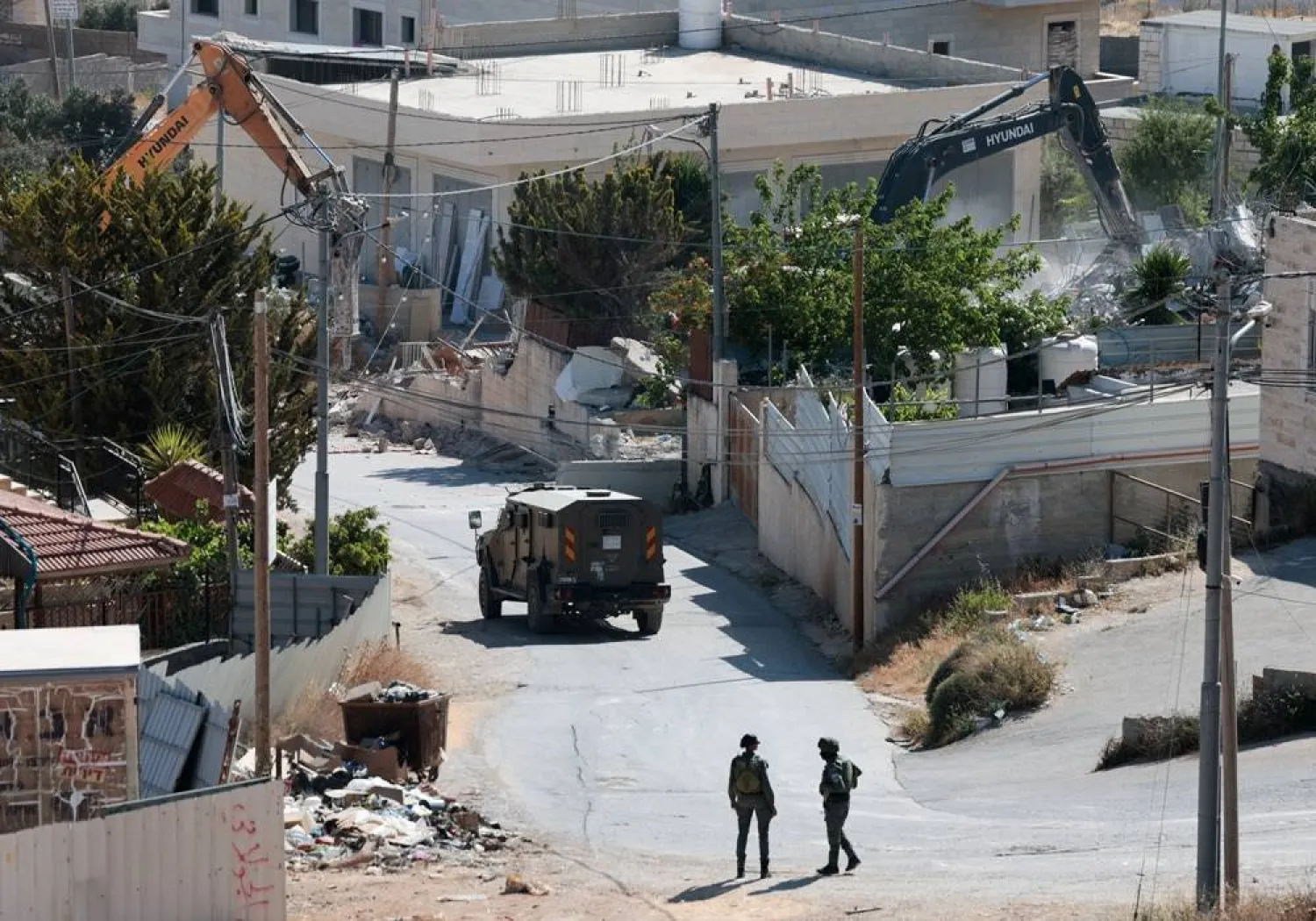  Israeli military excavators demolish a Palestinian building in the town of Jabaa in the Israeli-occupied West Bank, near Jerusalem June 3, 2026. (Reuters)