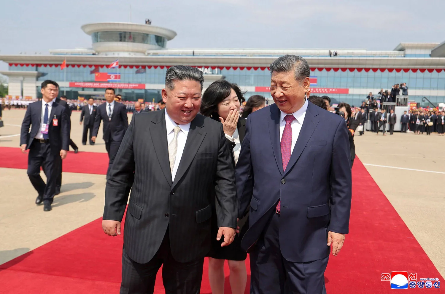 This picture taken on June 9, 2026 and released by North Korea's official Korean Central News Agency (KCNA) on June 10, 2026 shows North Korean leader Kim Jong Un (L) seeing off China's President Xi Jinping (R) during the latter's departure from Pyongyang International Airport. (KCNA via KNS / AFP)