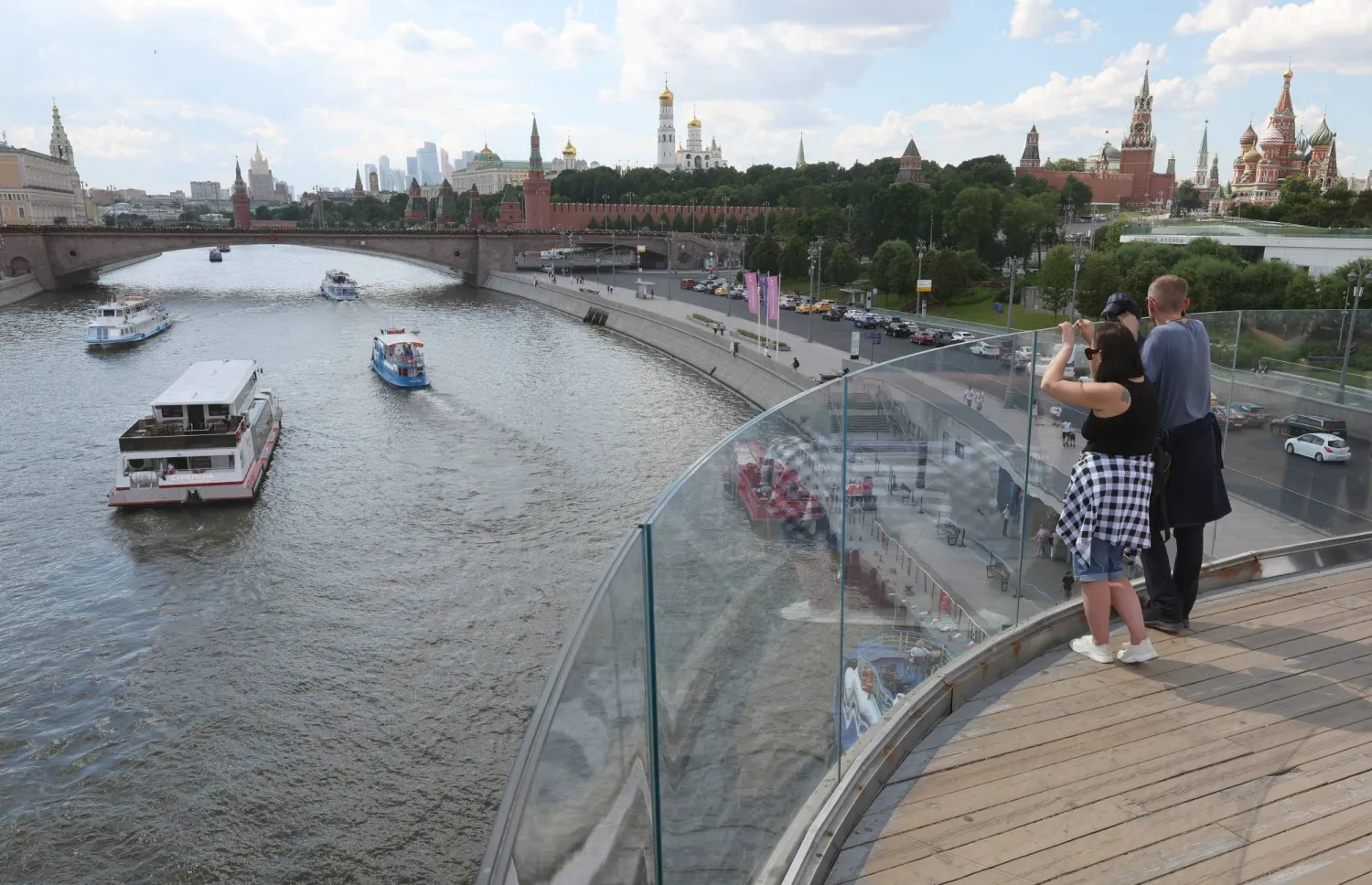 People rest outside the Kremlin on a warm summer day in downtown Moscow, Russia, 05 June 2026. EPA/MAXIM SHIPENKOV