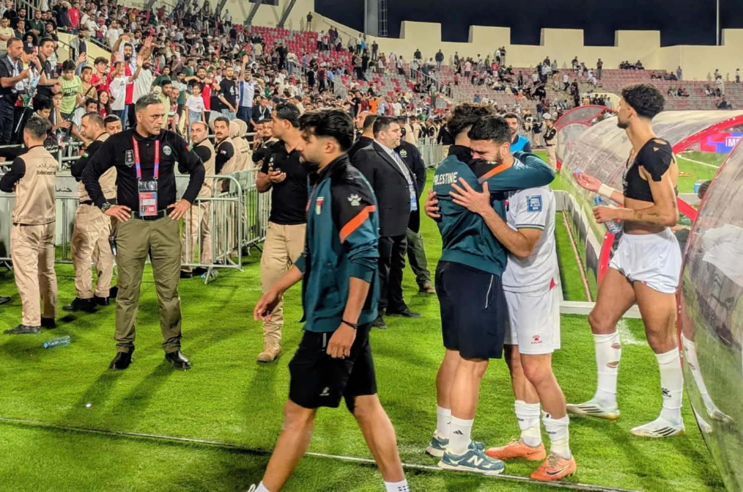 File: Palestinian players leave the field after an Asian Group B World Cup qualifying soccer match against Oman at the King Abdullah II Stadium in Amman, Jordan on June 12, 2025. (AP Photo/John Duerden)
