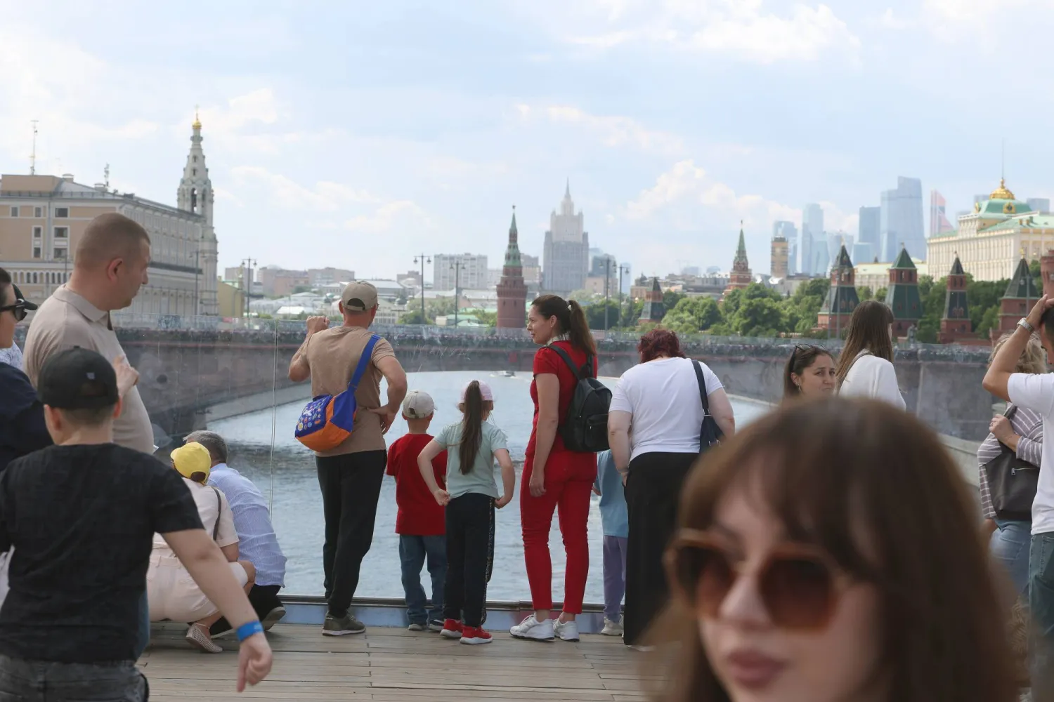 People rest outside the Kremlin on a warm summer day in downtown Moscow, Russia, 05 June 2026. EPA/MAXIM SHIPENKOV