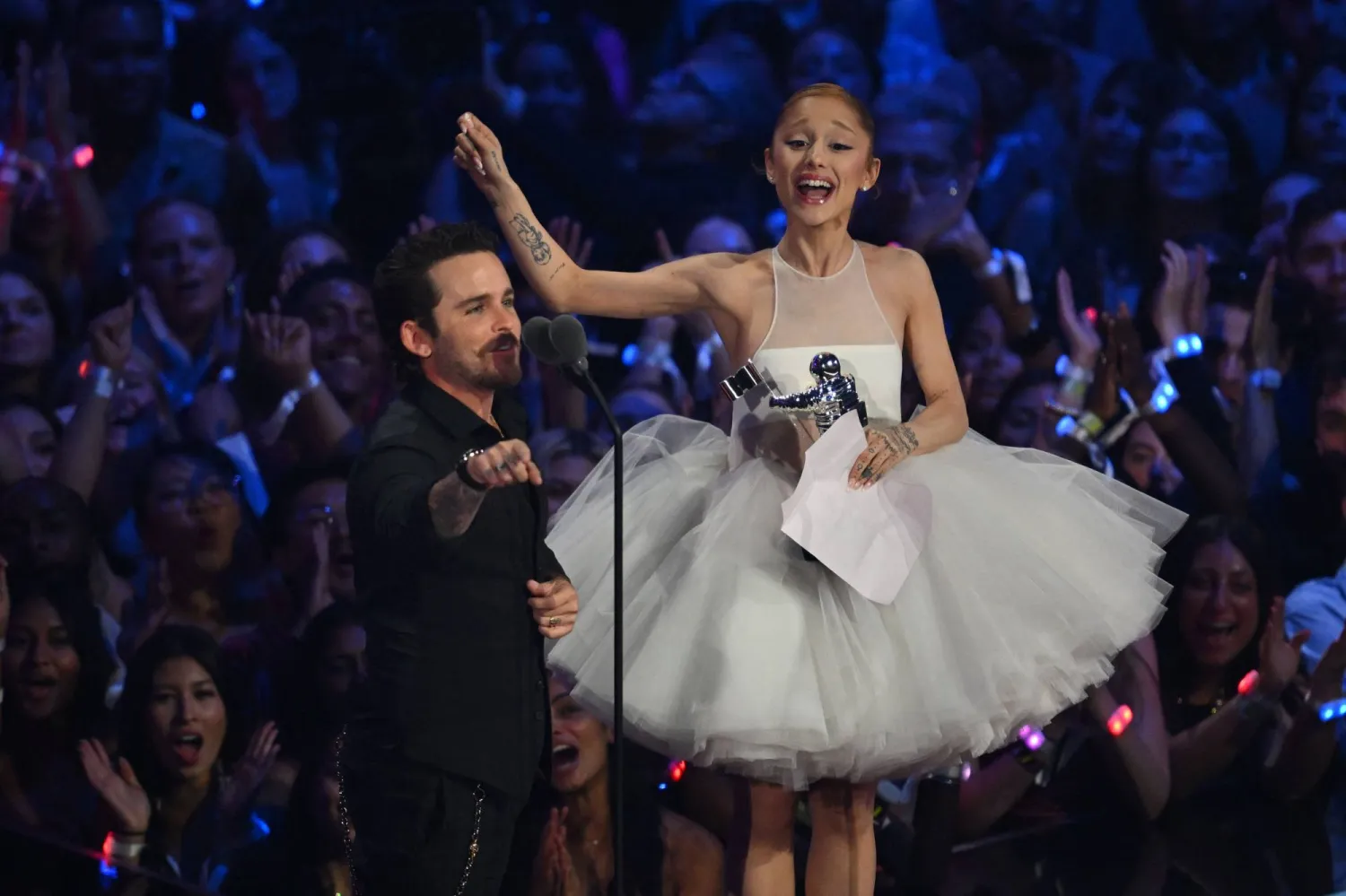 US singer-songwriter Ariana Grande (R) and US music video director Christian Breslauer accept the award for Video of the Year for "Brighter Days Ahead" on stage during the MTV Video Music Awards at UBS Arena in Elmont, New York, on September 7, 2025. (Photo by ANGELA WEISS / AFP)