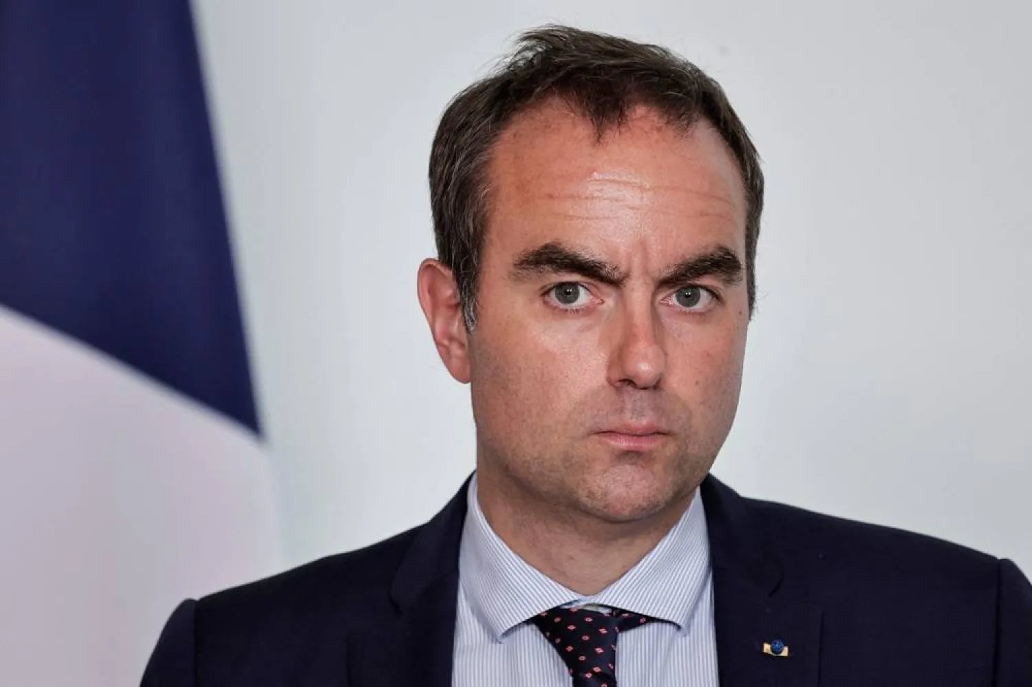 France's Prime Minister Sebastien Lecornu looks on during a press conference following a meeting with several political parties and security institutions representatives on safeguarding democratic debates against foreign interference after Paris prosecutors opened in May a probe to investigate whether an Israeli company interfered in local French elections, at the Matignon Hotel in Paris on June 11, 2026. (AFP)