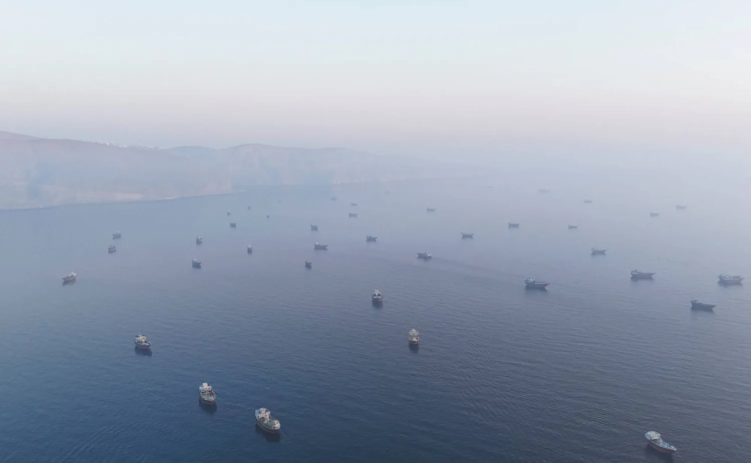 A drone view shows vessels in the Strait of Hormuz, as seen from Musandam, Oman, June 15, 2026. (Reuters)