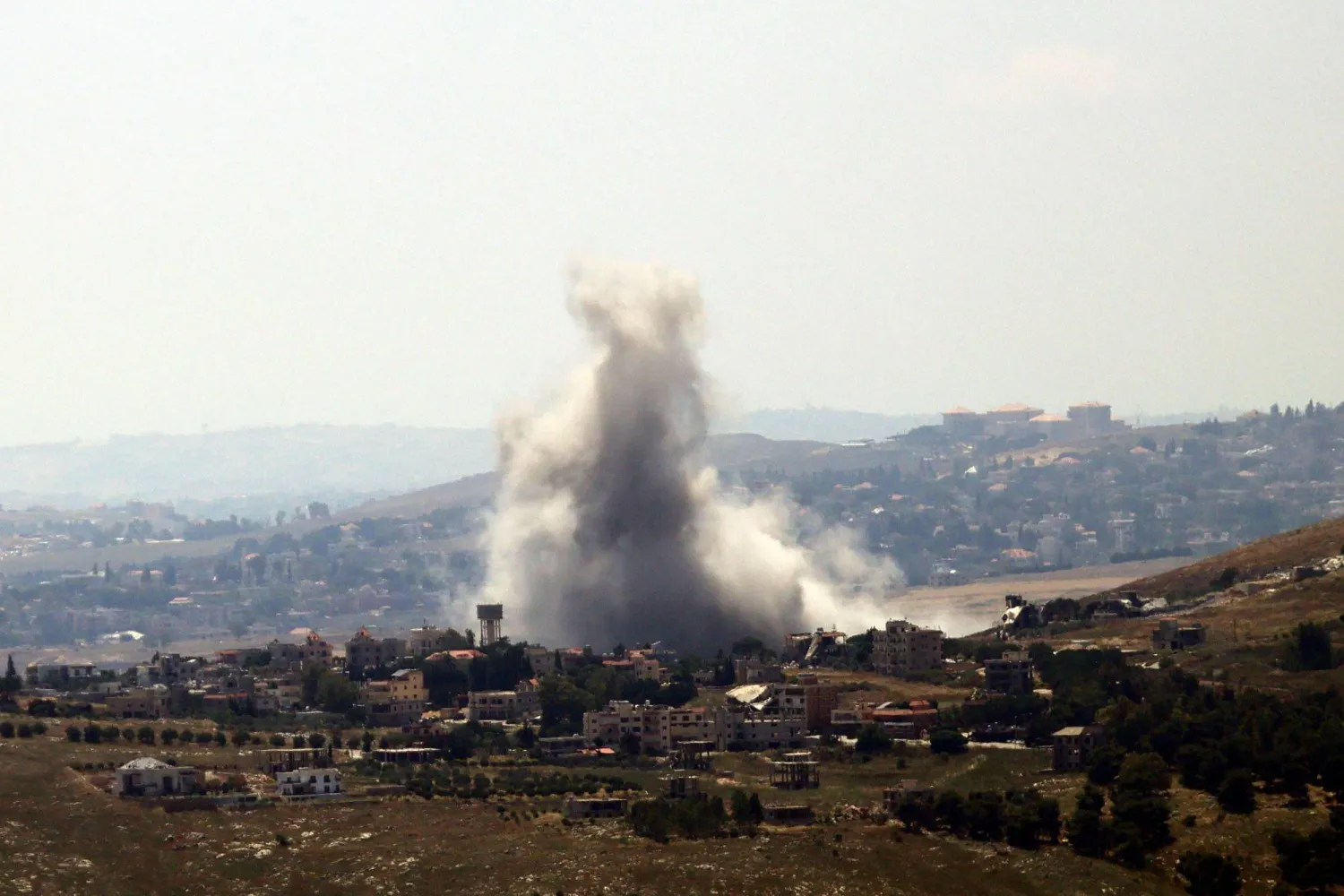 This photograph taken from the southern Lebanese area of Marjayoun shows smoke as it rises from the site of an Israeli airstrike that targeted the village of Kfar Tibnit on June 11, 2026. (Photo by AFP) / 