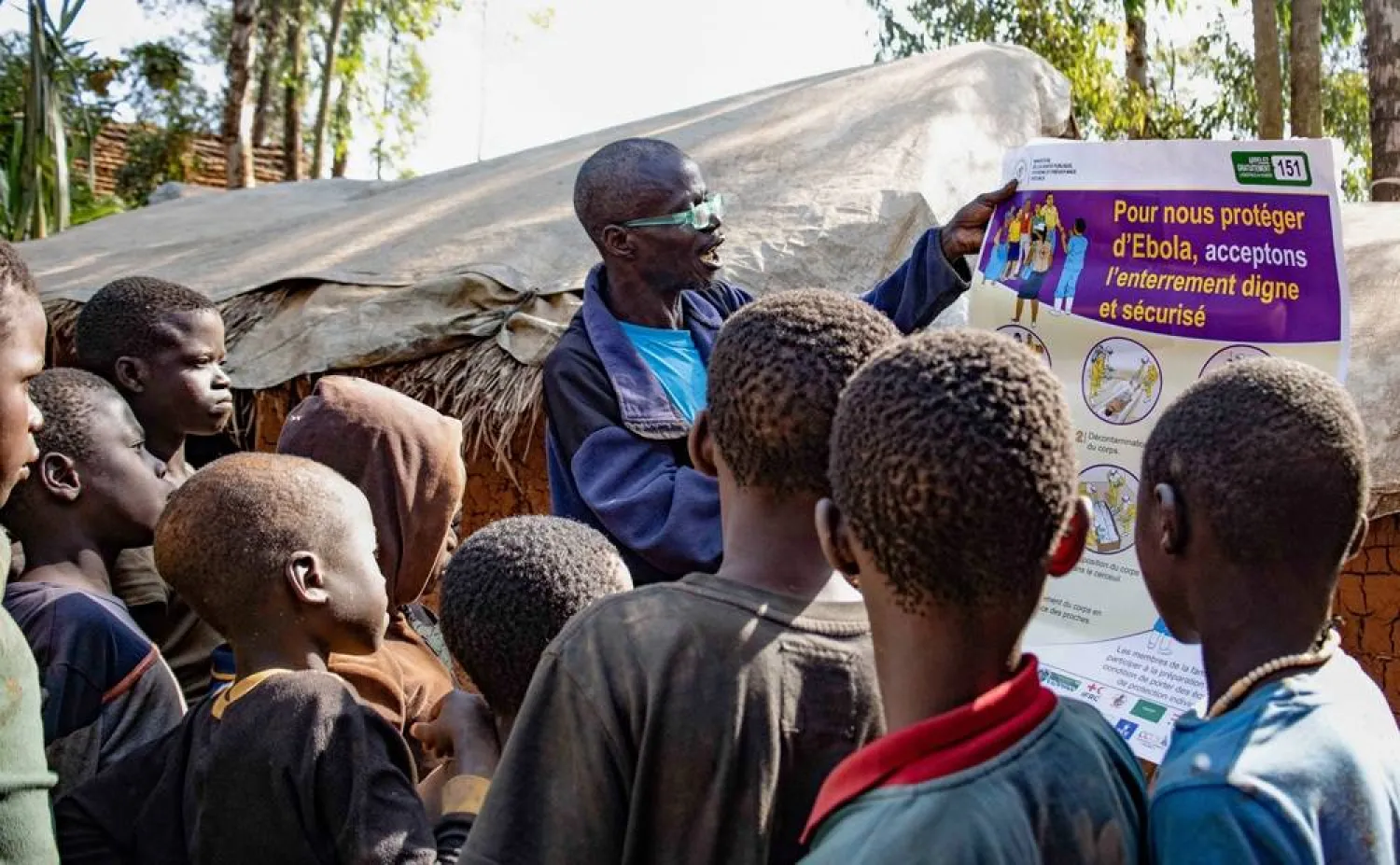 Dz'na Lipe Jean‑Marie, secretary of the displacement camp, speaks during an Ebola awareness session as humanitarian agencies intensify efforts to contain a new Ebola outbreak involving the Bundibugyo strain, at Kpangba displacement camp where Ebola cases were observed, Djugu territory in Ituri province, Democratic Republic of Congo, June 13, 2026. (Reuters)