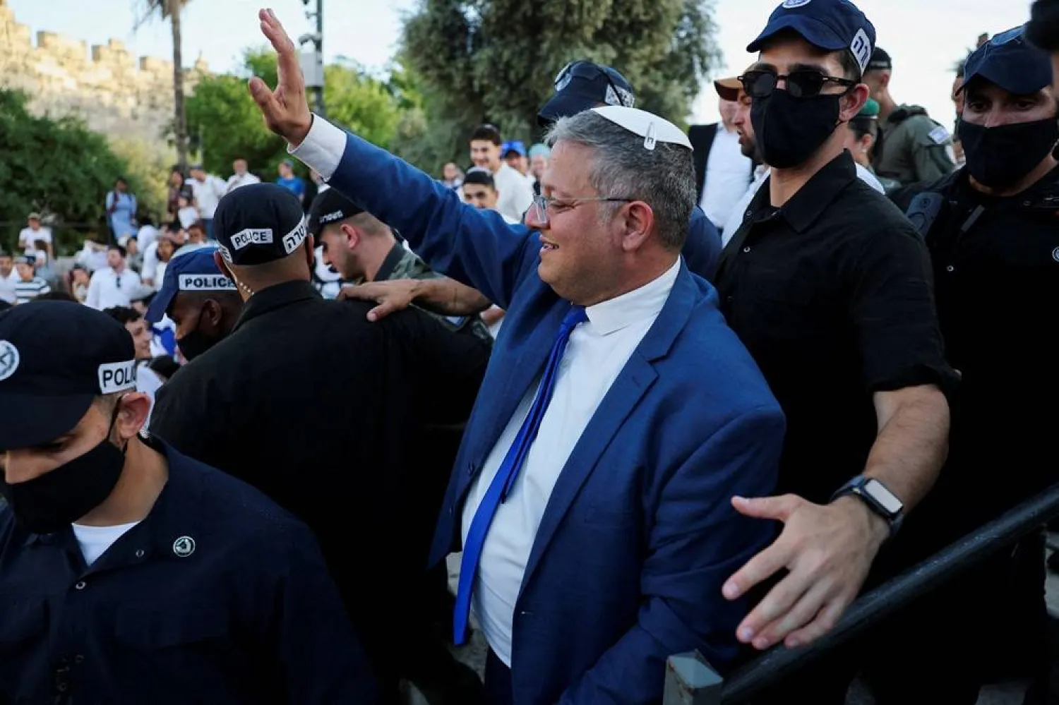 Israeli National Security Minister Itamar Ben-Gvir waves as people take part in the annual Jerusalem Day march in the Old City of Jerusalem, May 14, 2026. (Reuters)
