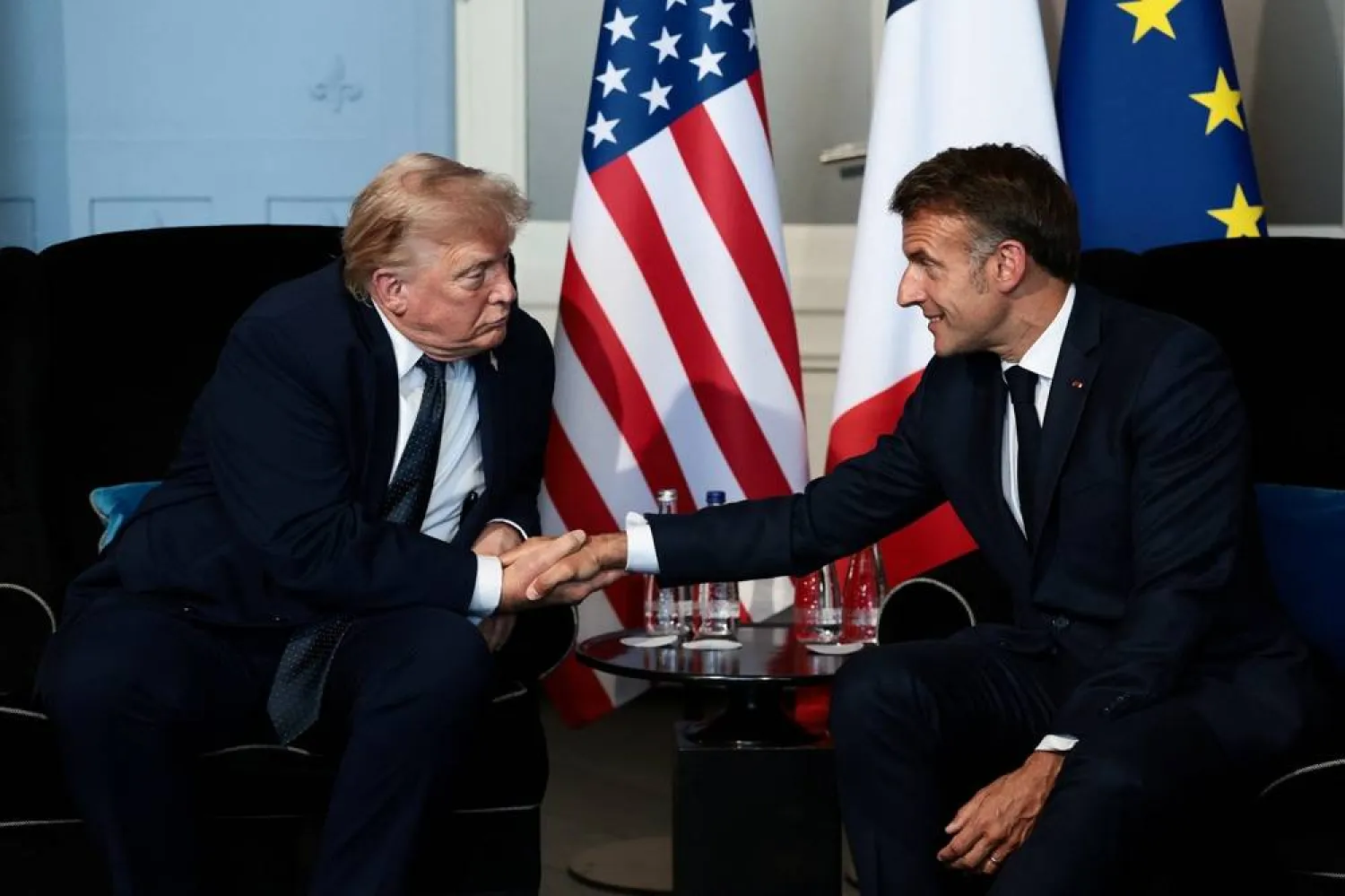 US President Donald Trump shakes hands with French President Emmanuel Macron as they attend a bilateral meeting during the G7 Summit in Evian-les-Bains, France, June 15, 2026. (Reuters)