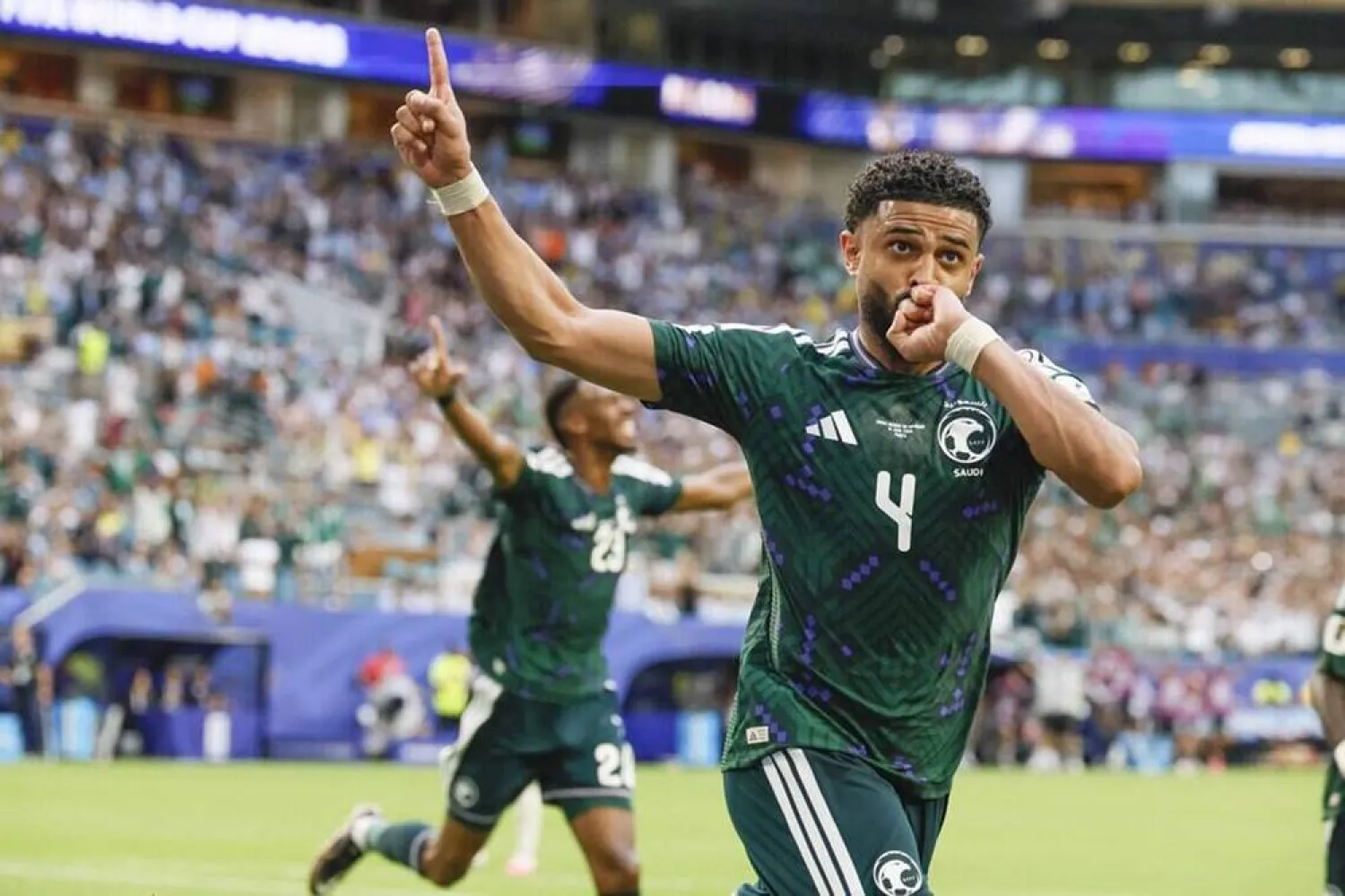 15 June 2026, US, Miami Gardens: Saudi Arabia's Abdulelah al-Amri celebrates scoring his side's first goal during the 2026 FIFA World Cup Group H soccer match between Uruguay and Saudi Arabia at Miami Stadium. (dpa)
