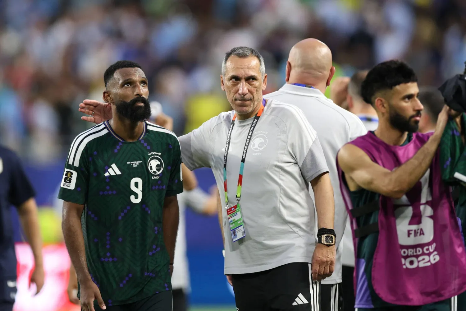 Saudi Arabia's Greek head coach Giorgos Donis talks to his forward #09 Feras Al-Brikan at the end of the 2026 World Cup Group H football match between Saudi Arabia and Uruguay at the Miami Stadium in Miami Gardens on June 15, 2026. (AFP)