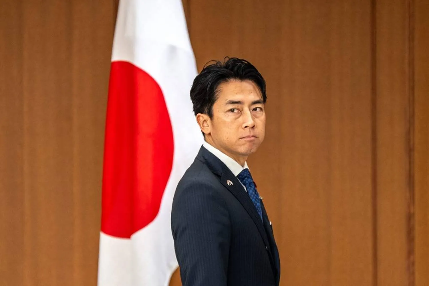 Japan's Defense Minister Shinjiro Koizumi stands before greeting Netherlands' Deputy Prime Minister and Defense Minister Dilan Yesilgoz-Zegerius during the Japan-Netherlands Defense Ministers' Meeting in Tokyo on June 16, 2026. (AFP) 