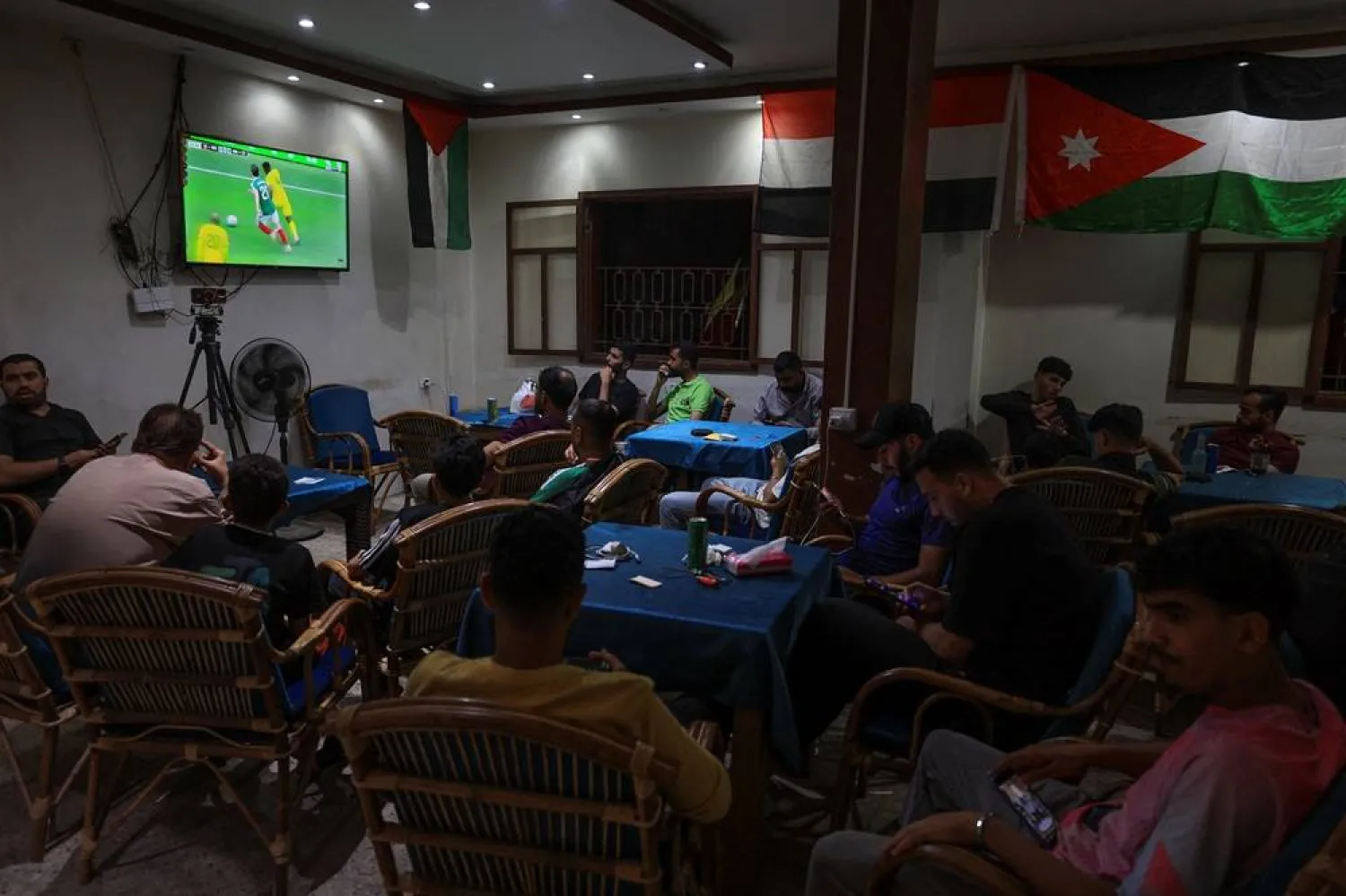  Palestinian football fans watch 2026 World Cup matches at a cafe in Gaza City, June 11, 2026. (Reuters)