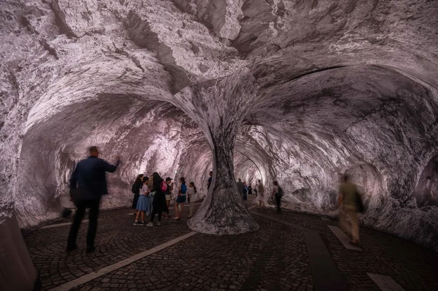  Visitors walk into the artwork "The Pont Neuf Cave" by French street artist JR on the Pont Neuf bridge, Tuesday, June 16, 2026, in Paris, open to the public from June 15 to 28. (AP)