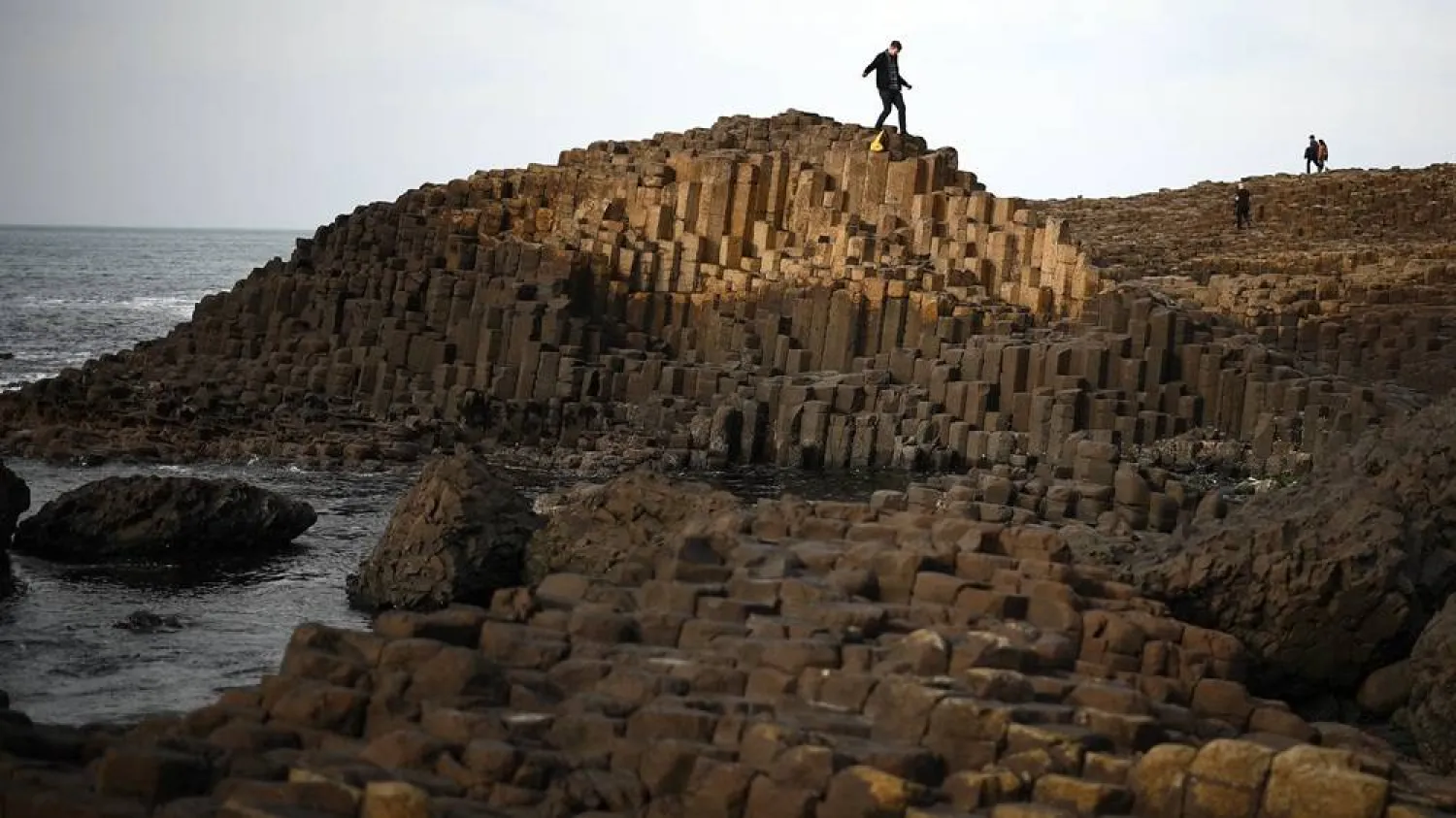 People explore the basalt columns of the Giant’s Causeway on Northern Ireland’s north coast on March 20, 2025. (AFP via Getty Images) 