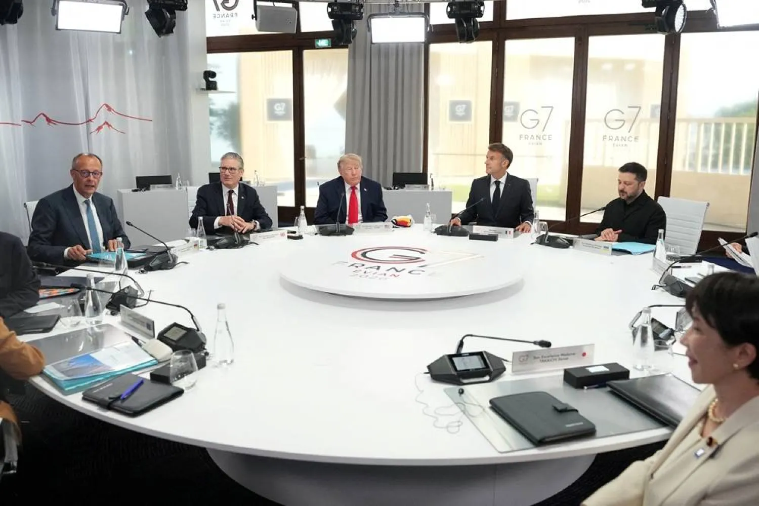 German Chancellor Friedrich Merz, British Prime Minister Keir Starmer, US President Donald Trump, French President Emmanuel Macron, Ukrainian President Volodymyr Zelenskyy and Japan’s Prime Minister Sanae Takaichi during a working session at the G7 summit in Evian-les-Bains, France, June 16, 2026. (Reuters)