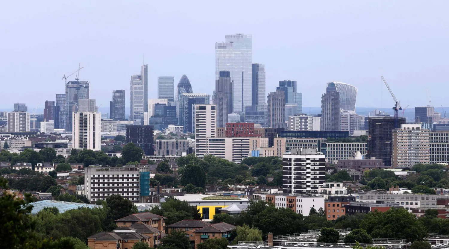 Skyscrapers and office buildings in the City of London are pictured from Hampstead Heath in north London on June 18, 2026. (Photo by Toby Shepheard / AFP)
